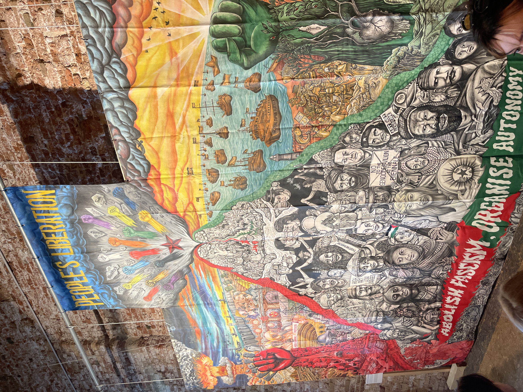 Political art banners displayed in Venice building interior