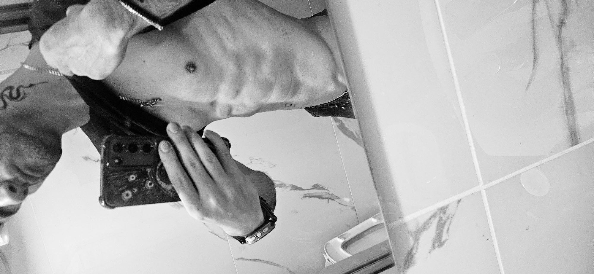 Person takes bathroom mirror selfies in Plovdiv, Bulgaria