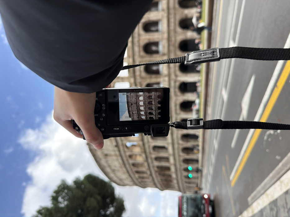 Tourist documents Colosseum visit with photos in Rome