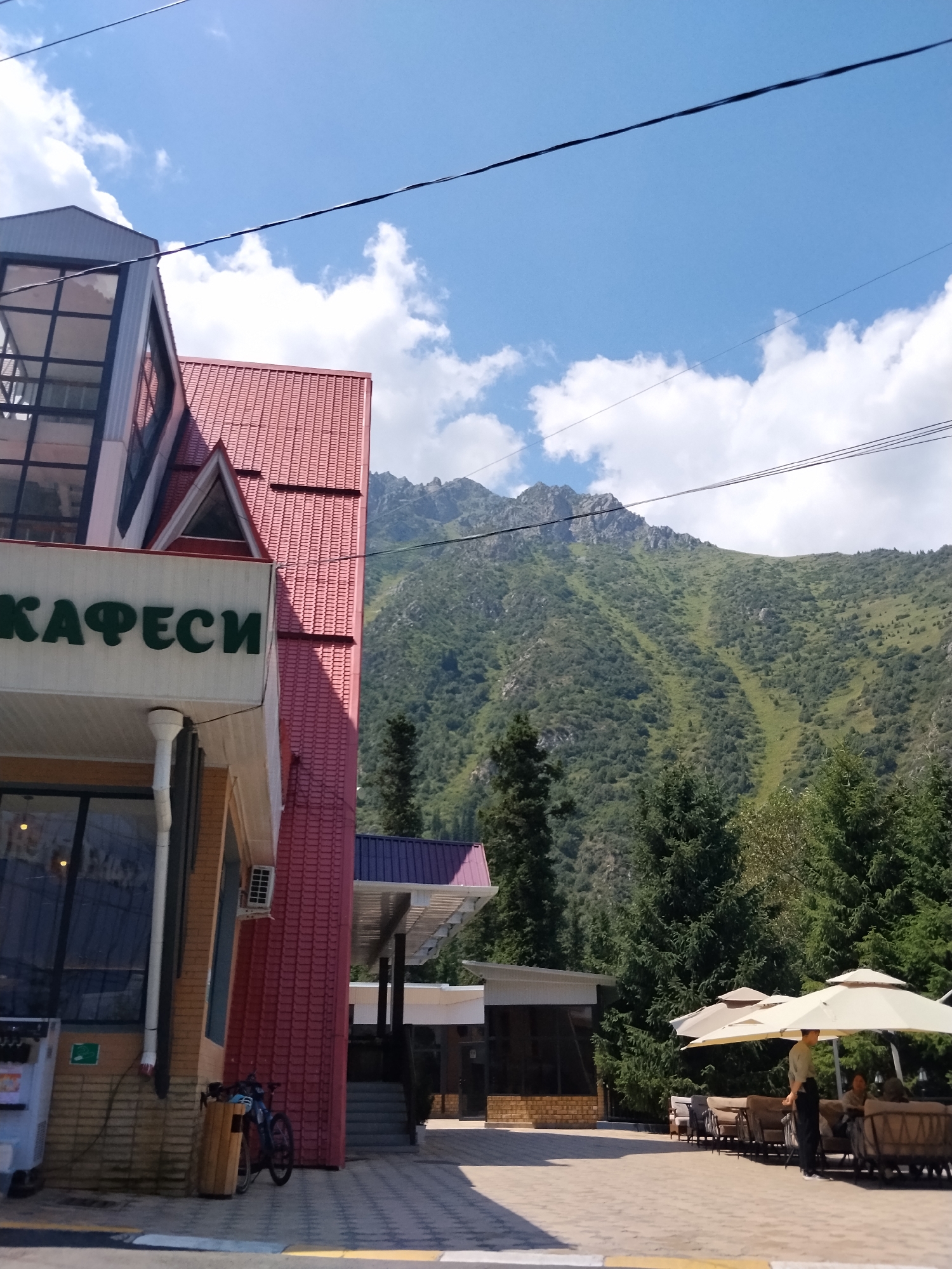 Mountain leisure spot in Kyrgyzstan, busy on a summer morning