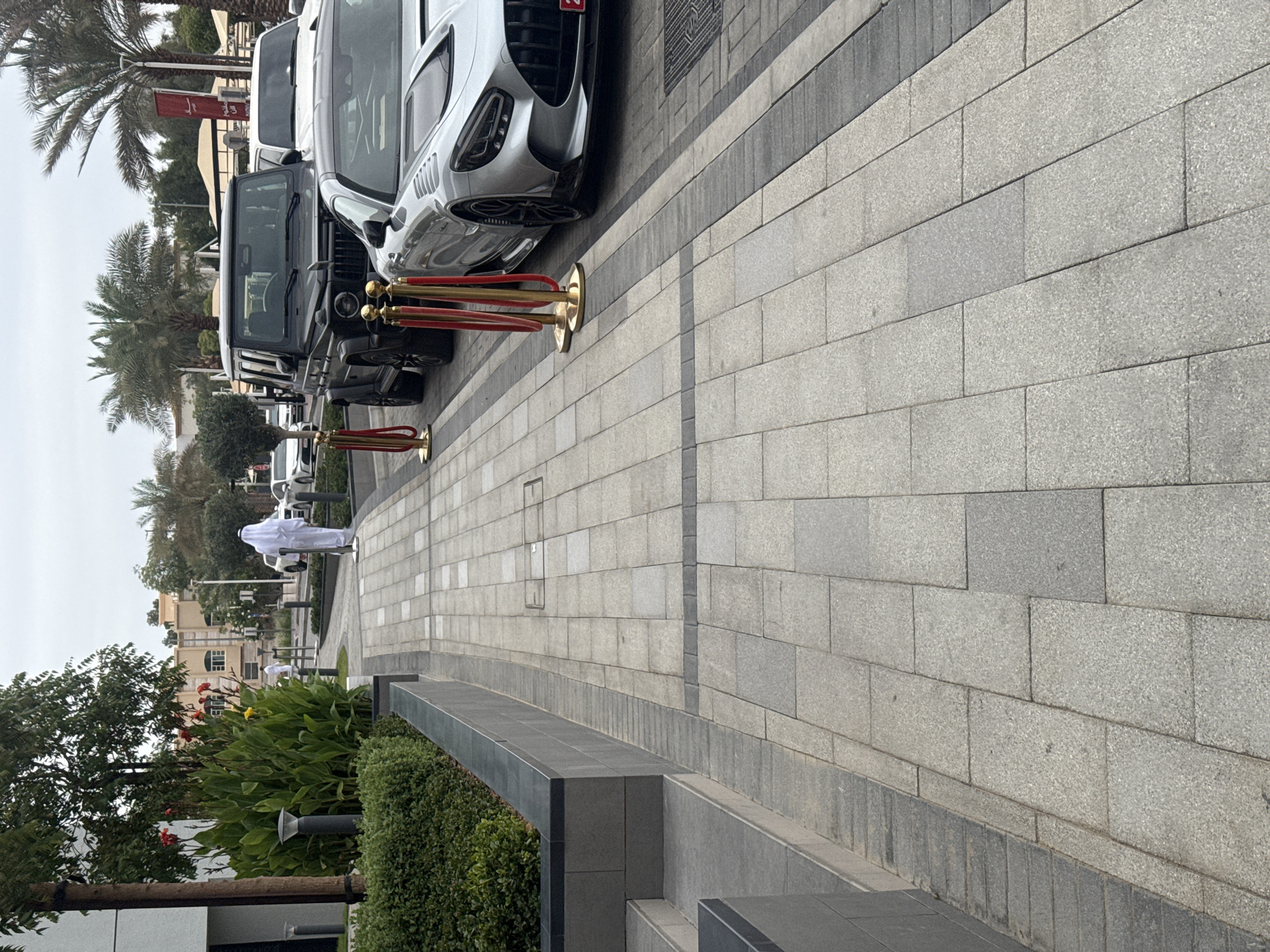 Luxury cars line Al Jimi street with rope barriers