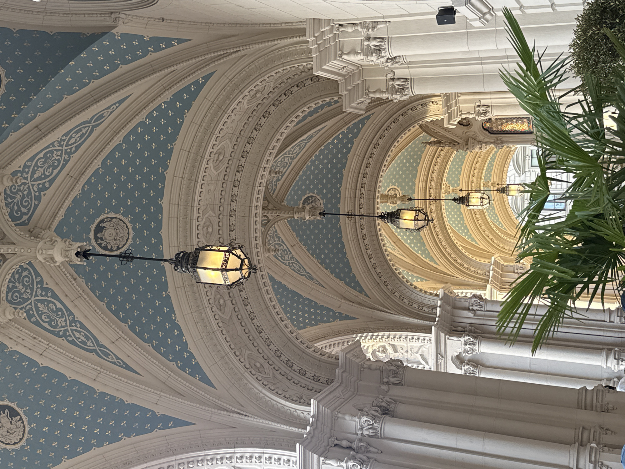 Visitor captures ornate ceiling details at Budapest's Párisi Udvar Hotel