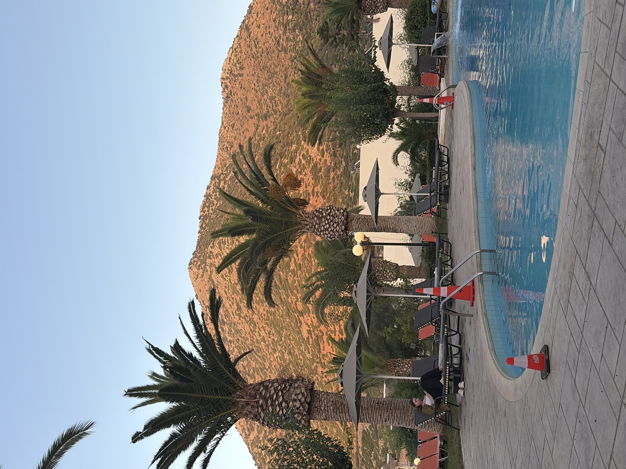 Poolside afternoon at a Vlichada, Santorini retreat