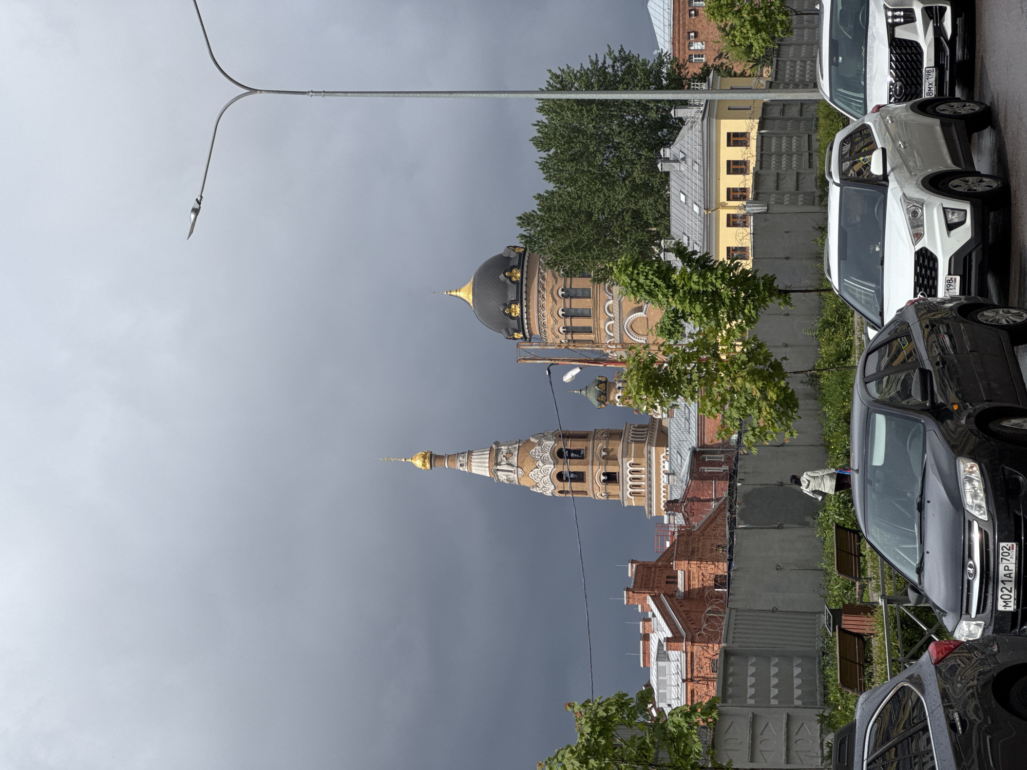 Saint Petersburg's golden church spires photographed under overcast skies