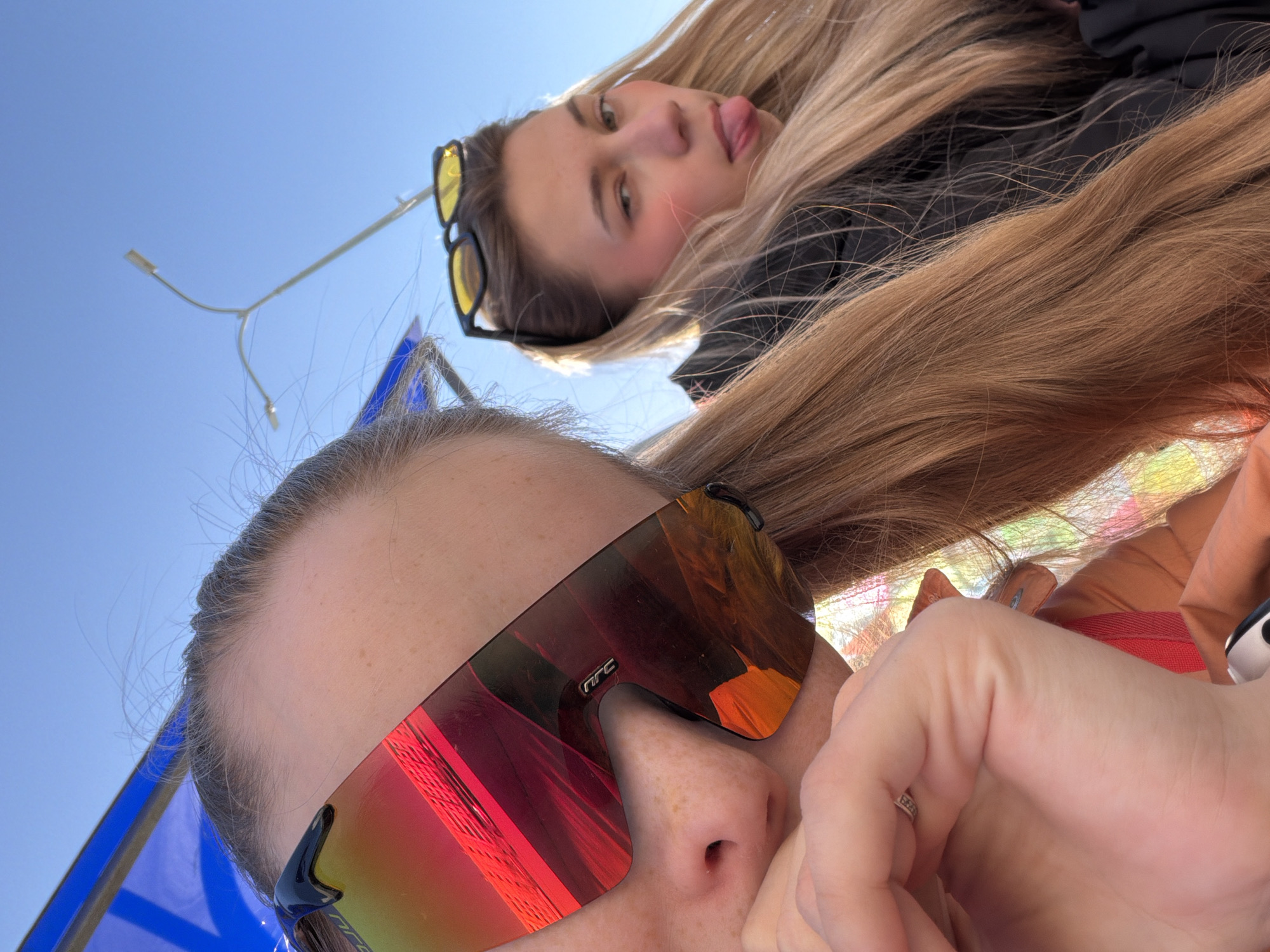 Two women take selfies outdoors in Berezniki, Russia