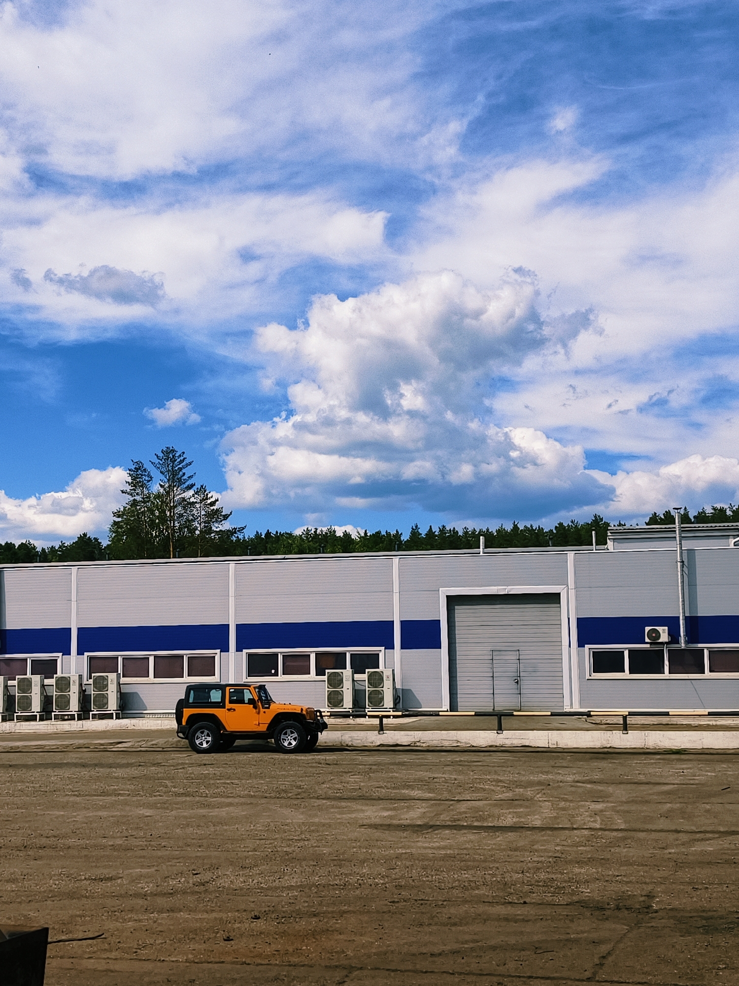 Orange Jeep Wrangler spotted at industrial building in Noviy