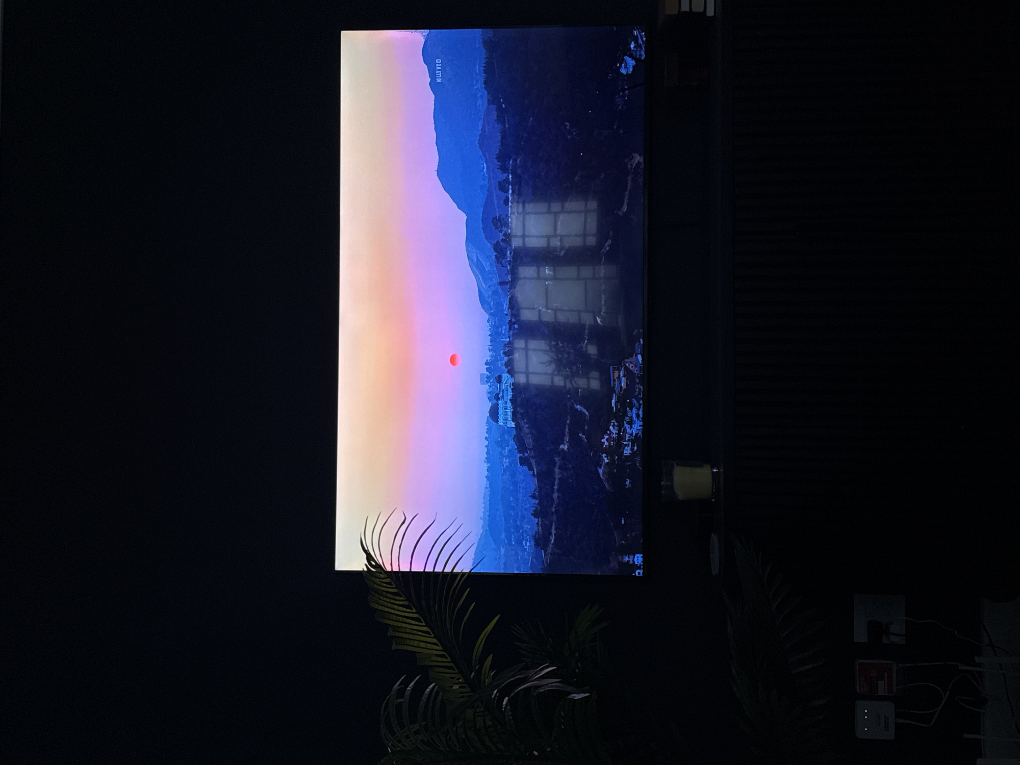 Large vertical screen shows landscape scene in Cape Town