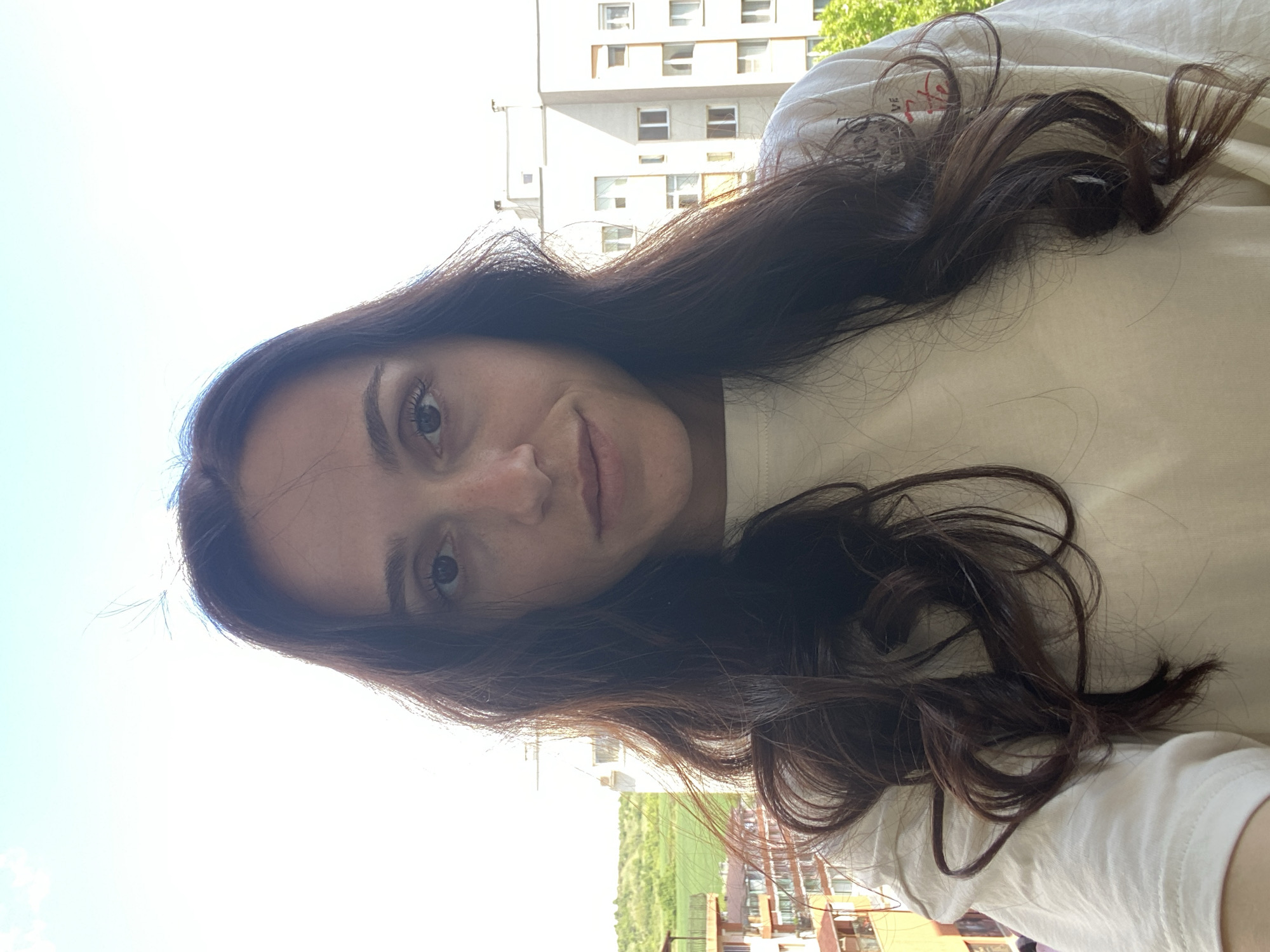 Woman takes selfie on balcony in Blagoevgrad, Bulgaria