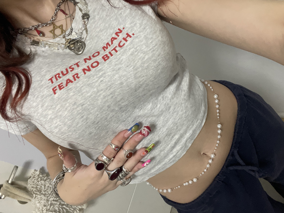 Young woman takes multiple mirror selfies in Raanana bedroom