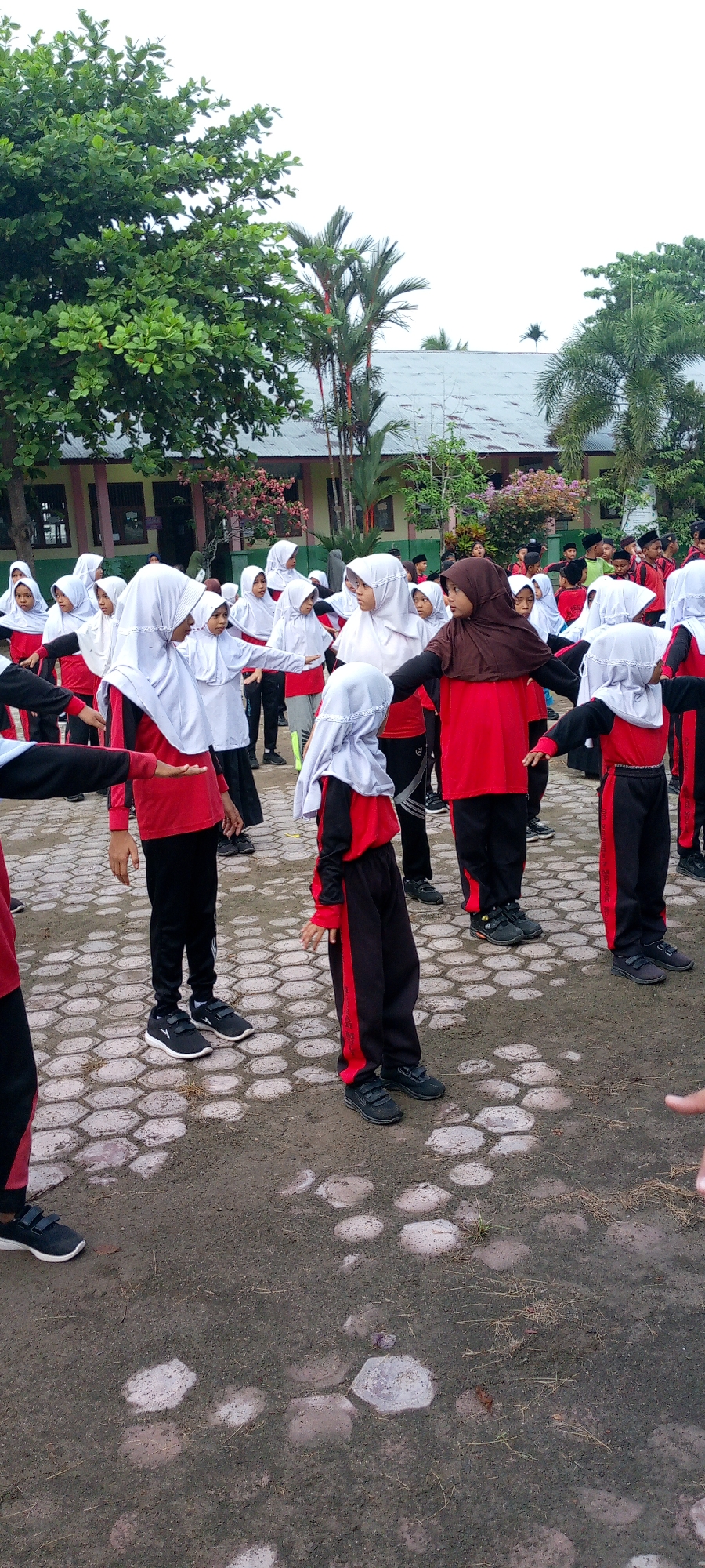 Indonesian school morning: PE, plants, and handmade crafts