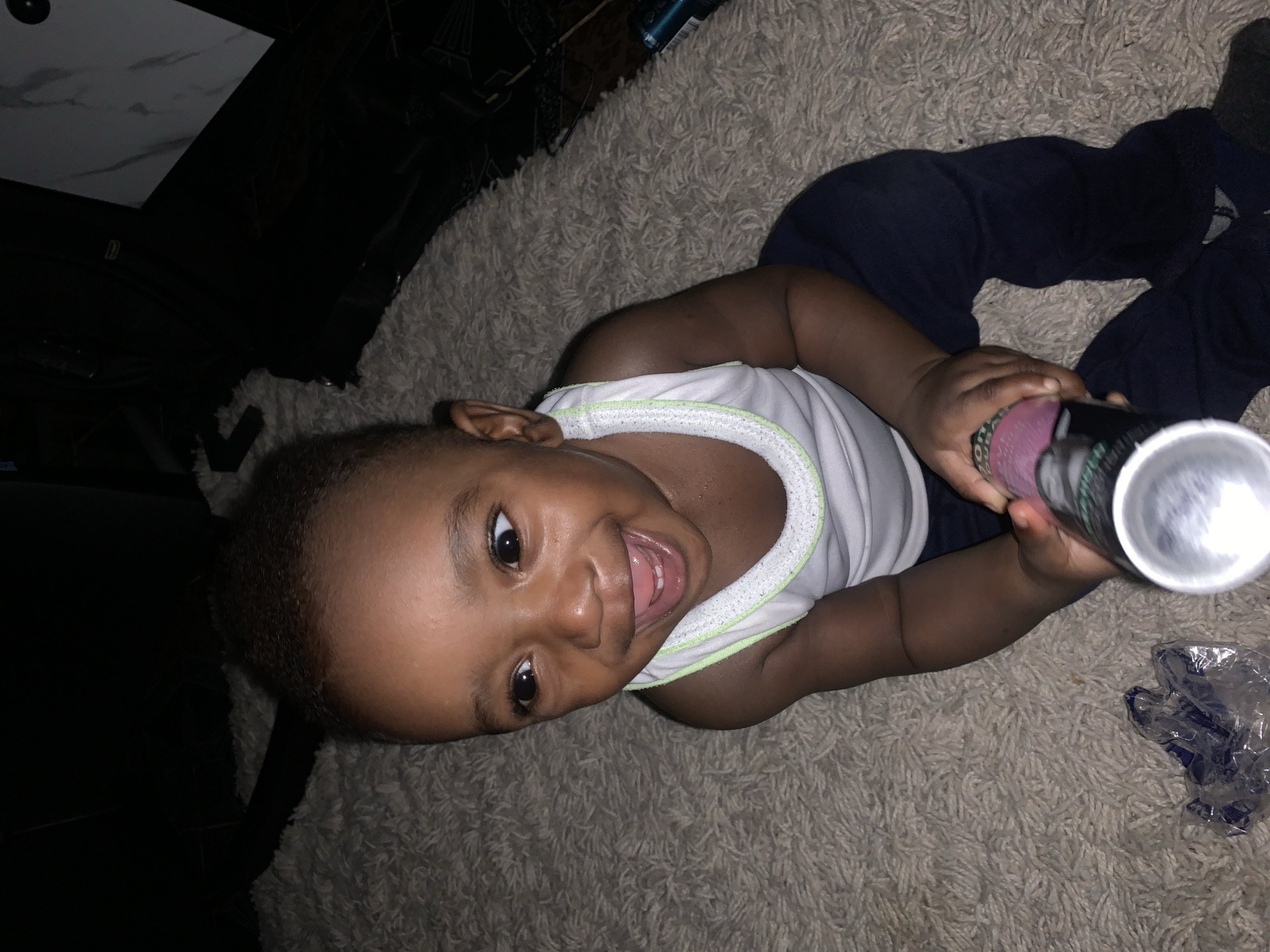 Toddler plays indoors in Barakin Akawo, Nigeria