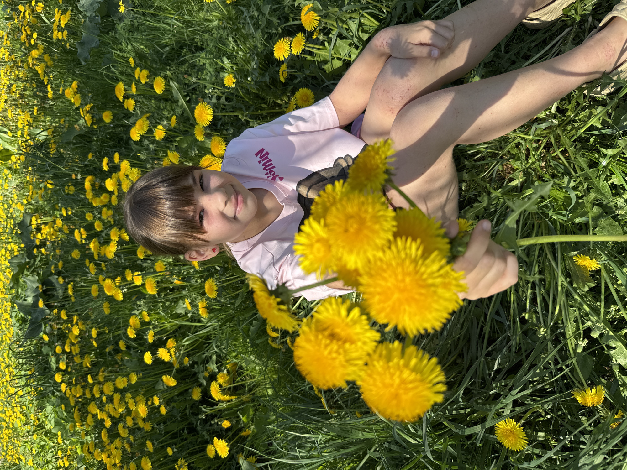 Pink-clad figures photographed with flowers in morning scenes