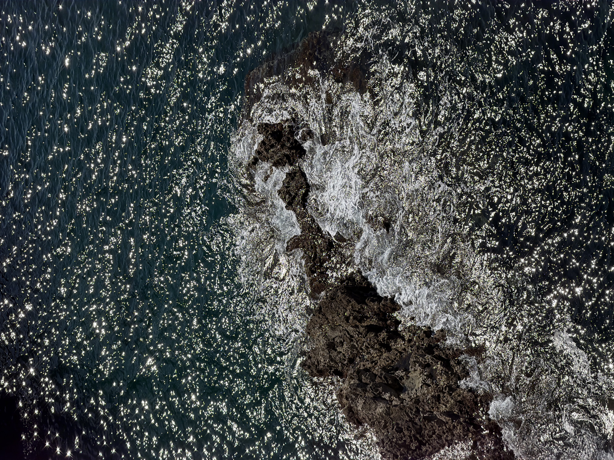 Morning sunlight illuminates rocky coastline near Prijevorac, Montenegro