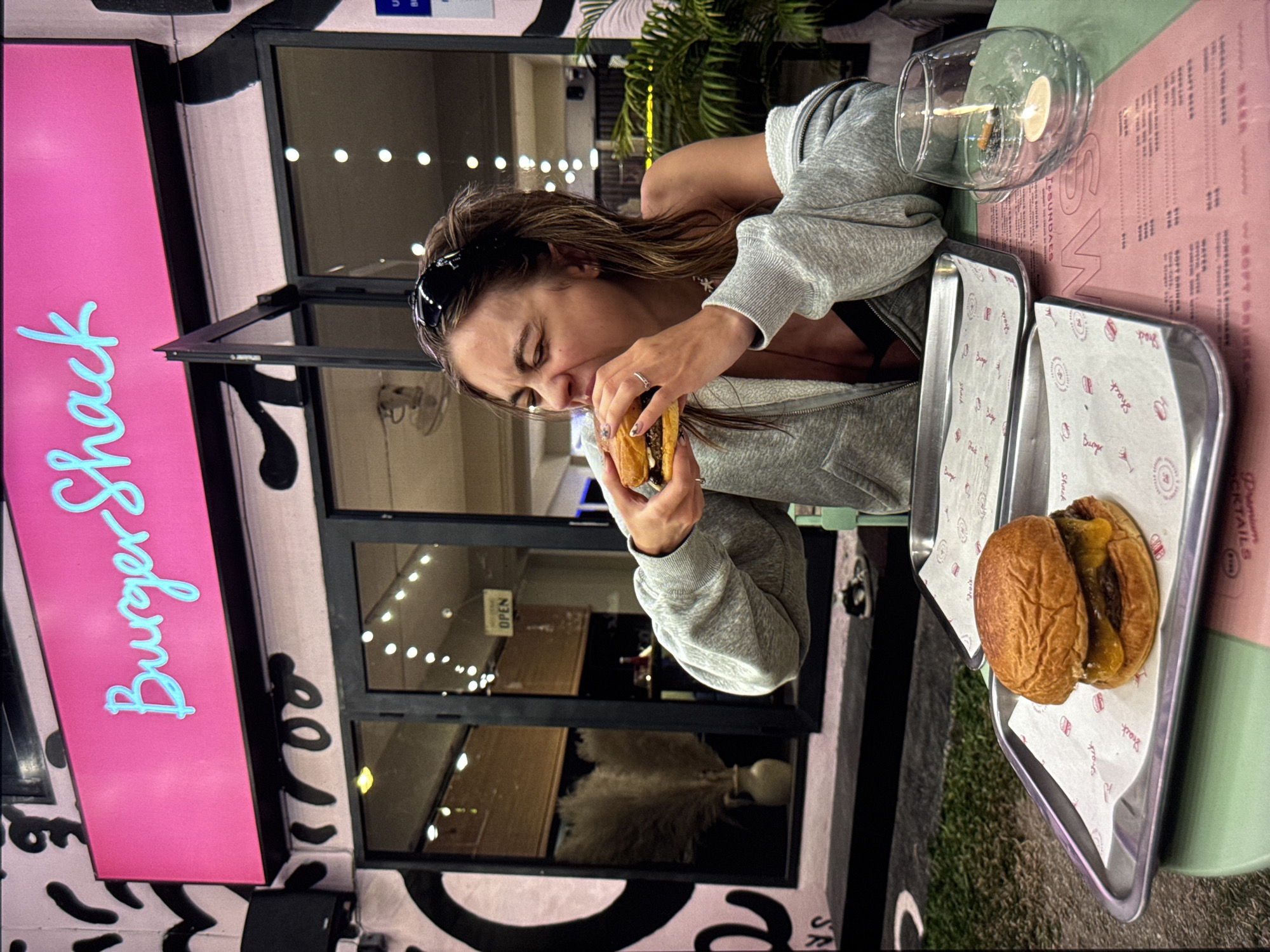 Woman spotted at Moscow shoreline and burger restaurant