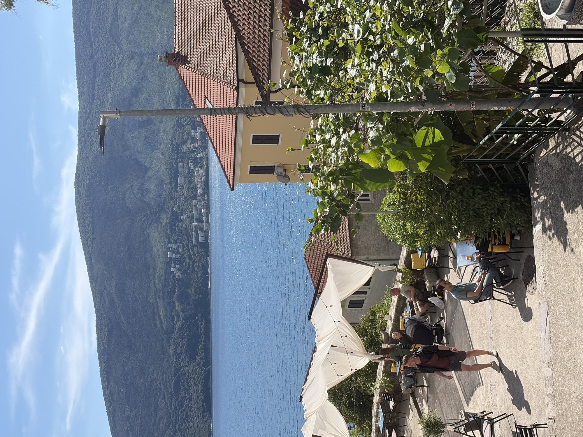 Afternoon cafe scenes and concert setup captured in Herceg Novi