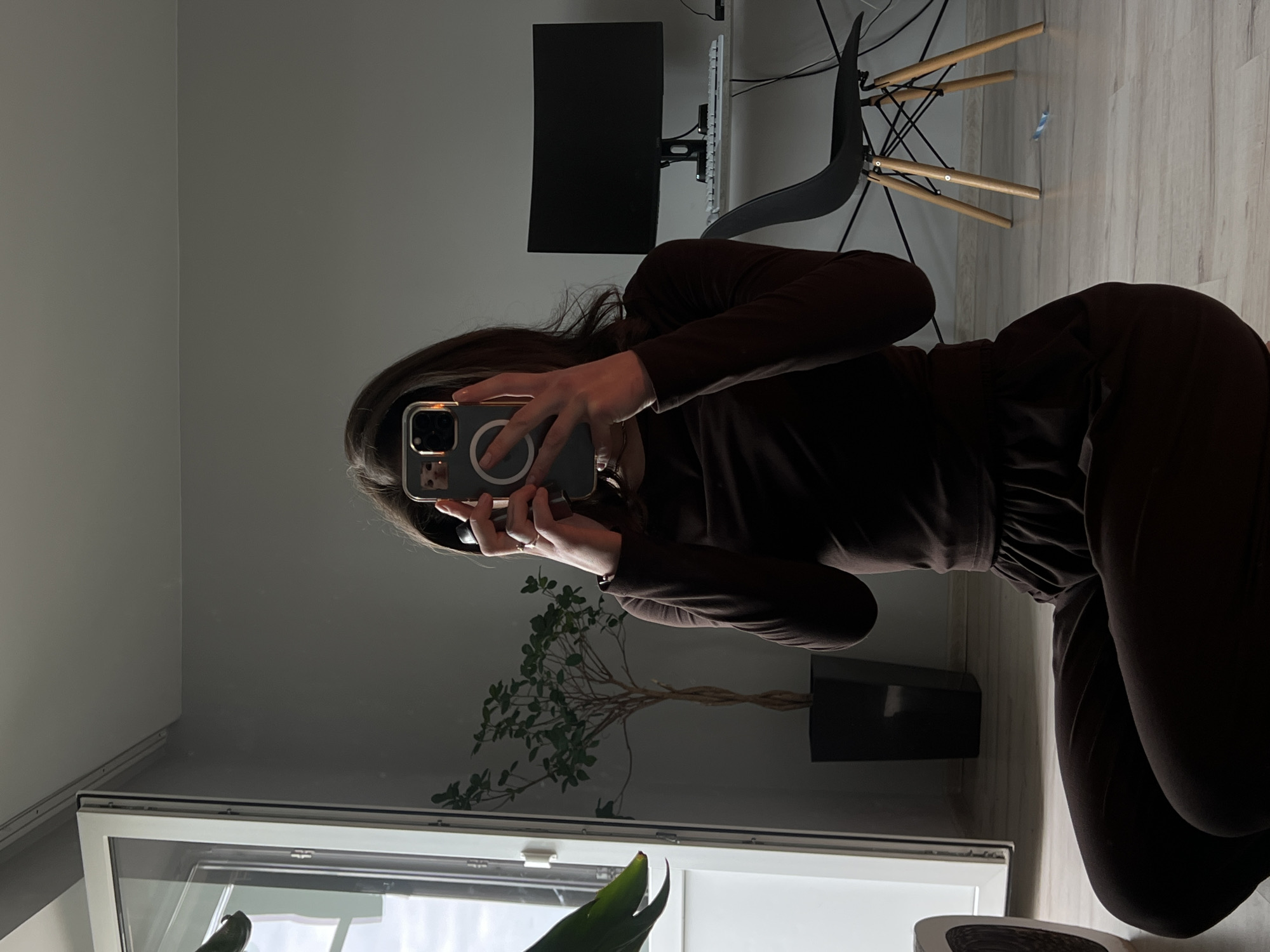 Mirror selfie session in a Ternopil apartment, brown outfit
