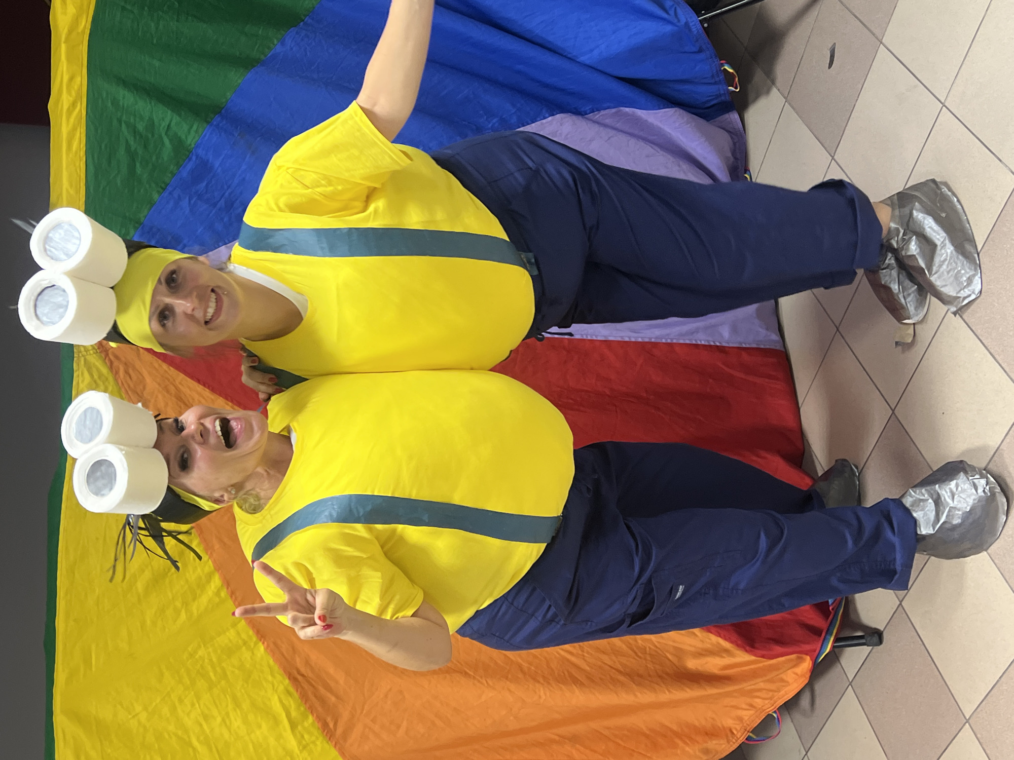 Minion costumes and rainbow parachute at a Polish summer event