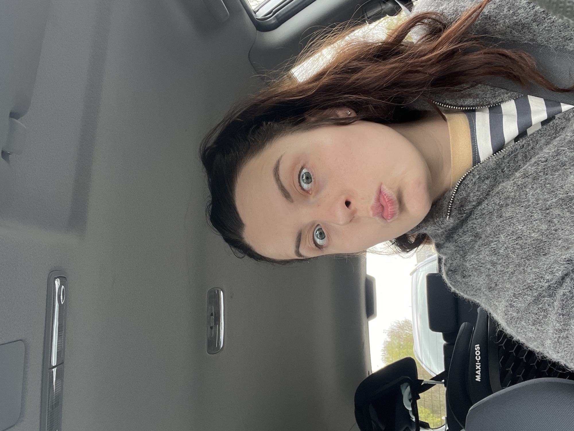 Woman takes selfie in vehicle in Meisenheim