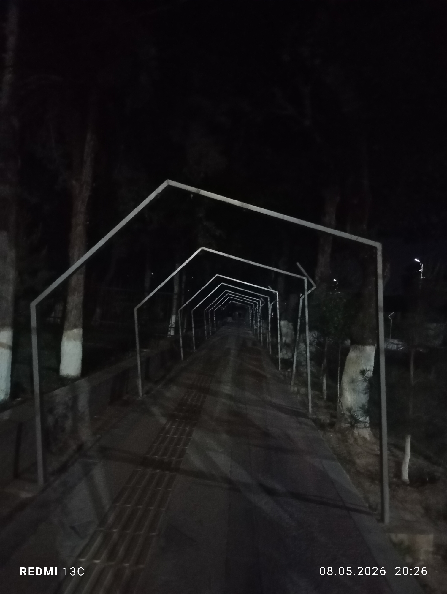Empty night walkway documented in Gazalkent, Uzbekistan