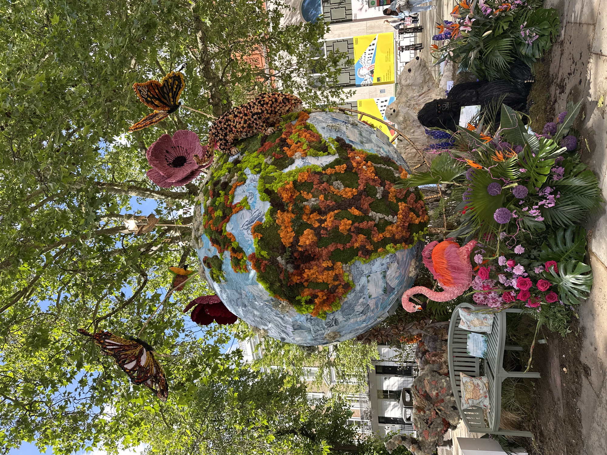 London street scenes feature globe sculpture, decorated RIXO storefront