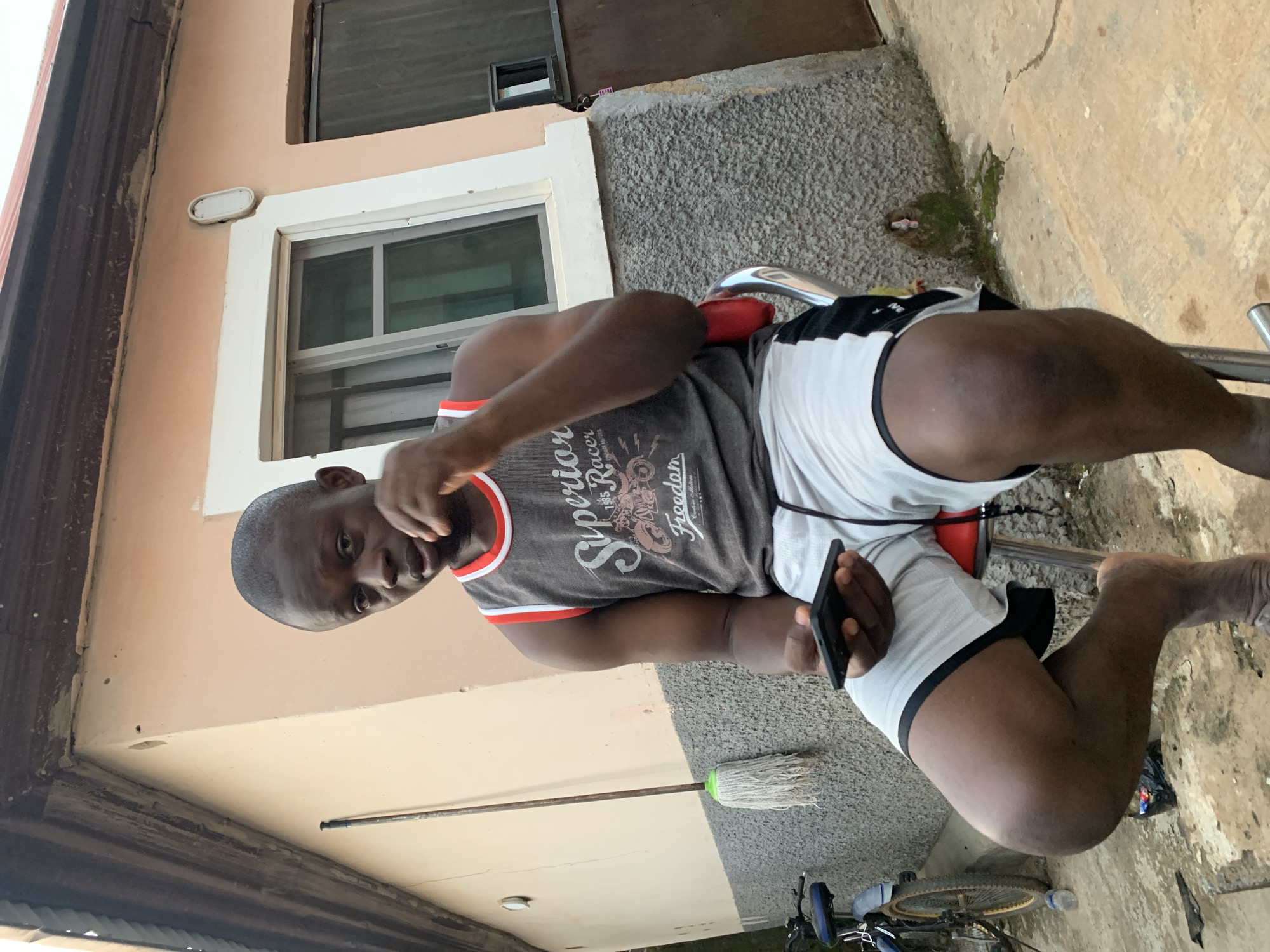 Residents gather with smartphones in Abuja residential area