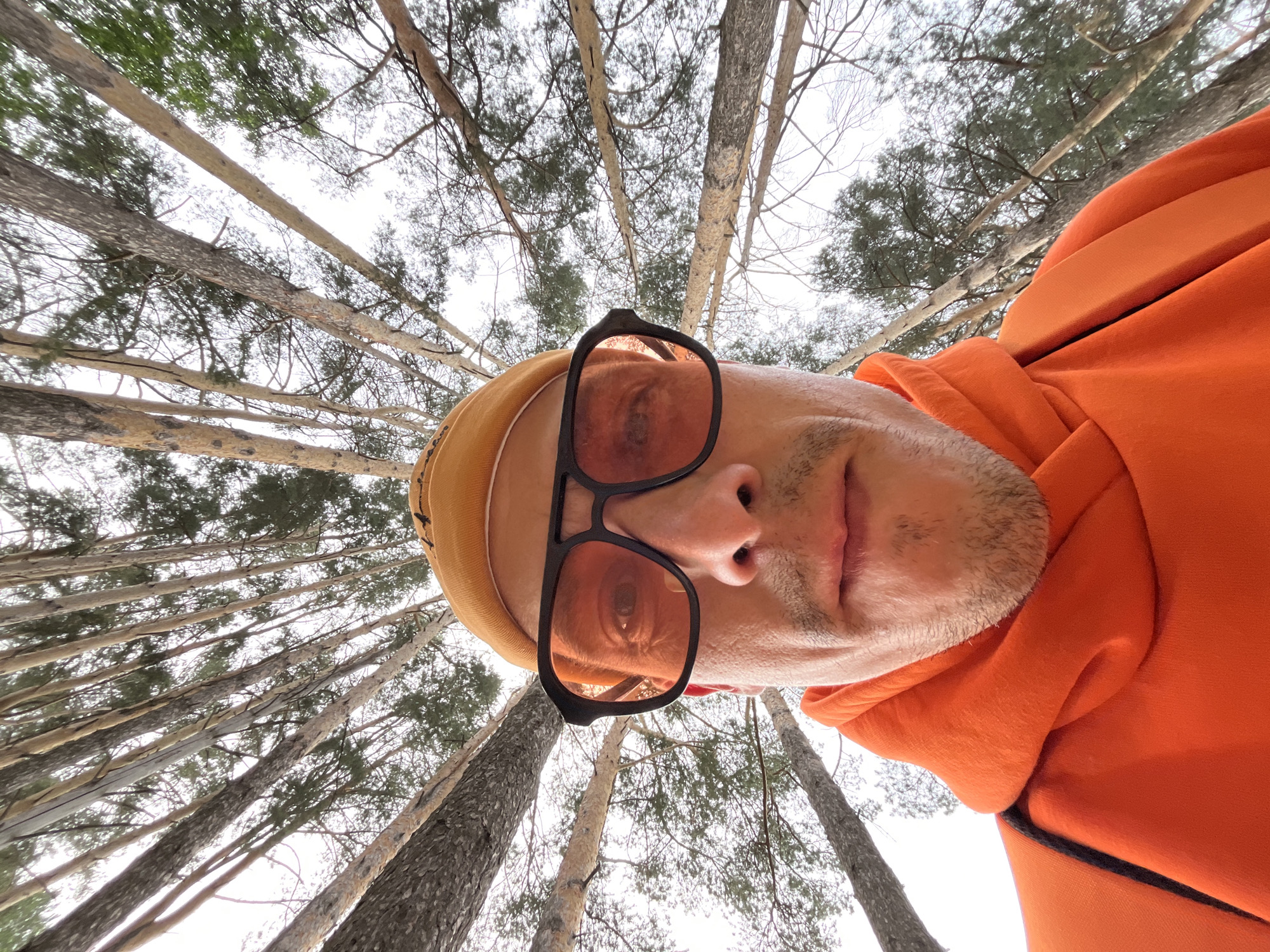 Man in orange clothing photographed multiple times in Chaikovsky