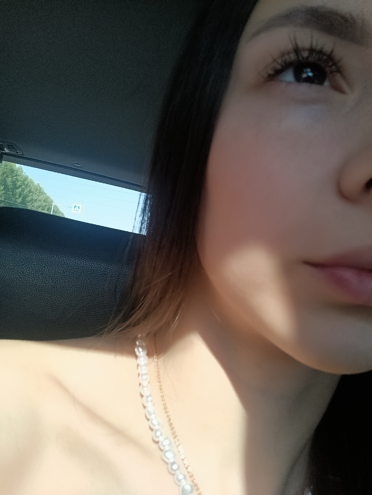 Woman in pearl necklace observed in car in Новая Казмаска