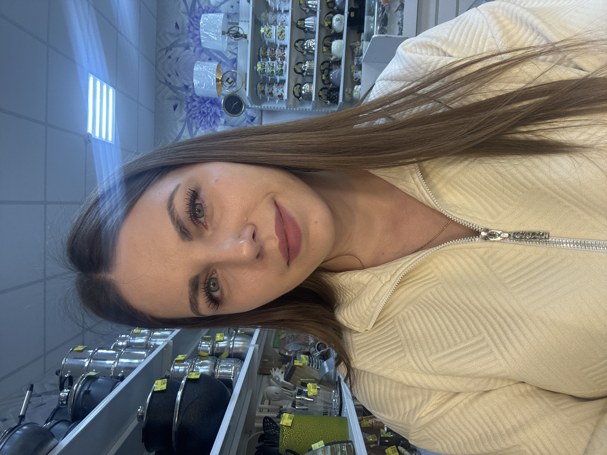 Woman documents shopping trip with selfies in Klin store