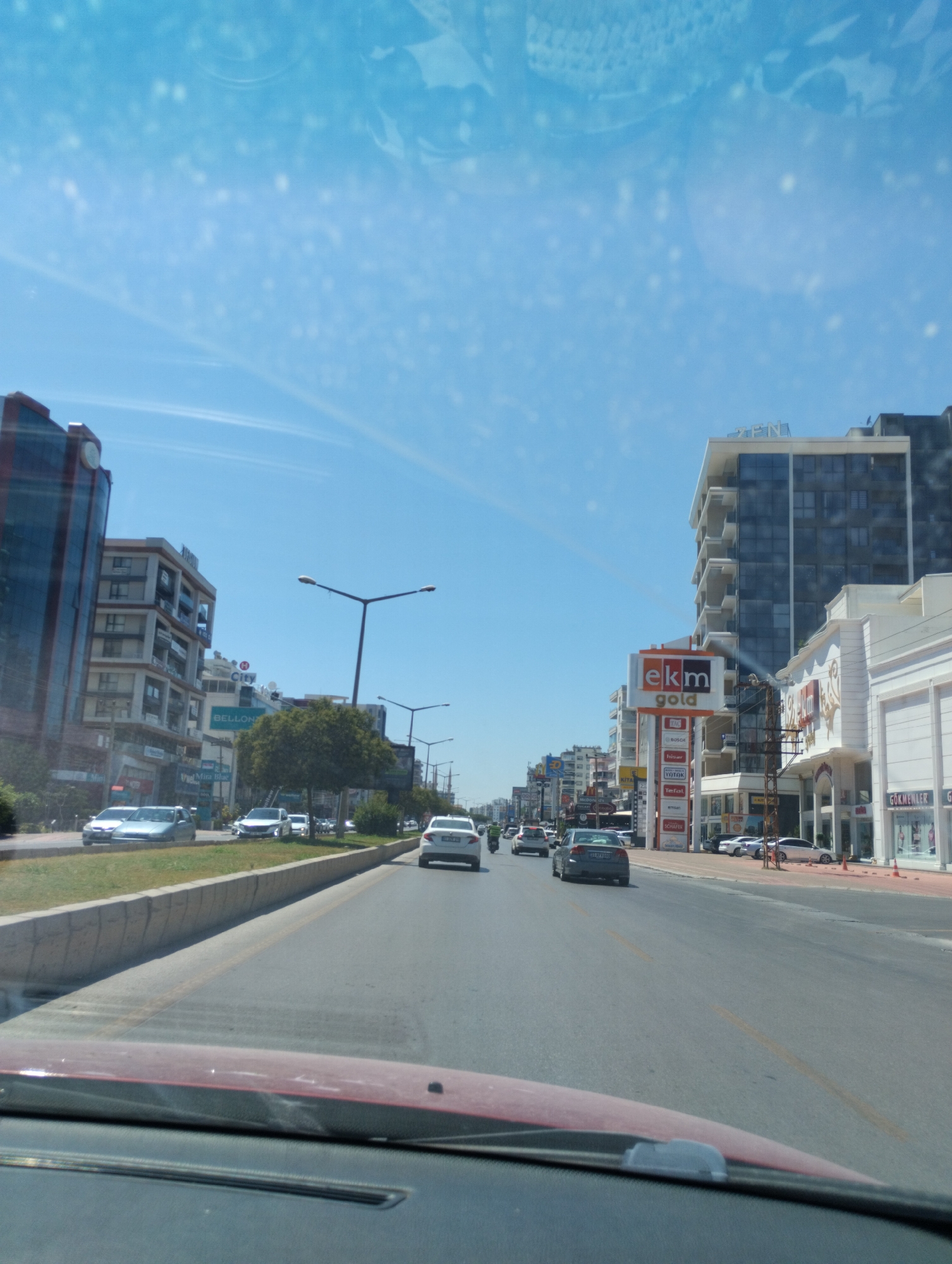 Dashcam-style drive through Mezitli streets on a clear morning