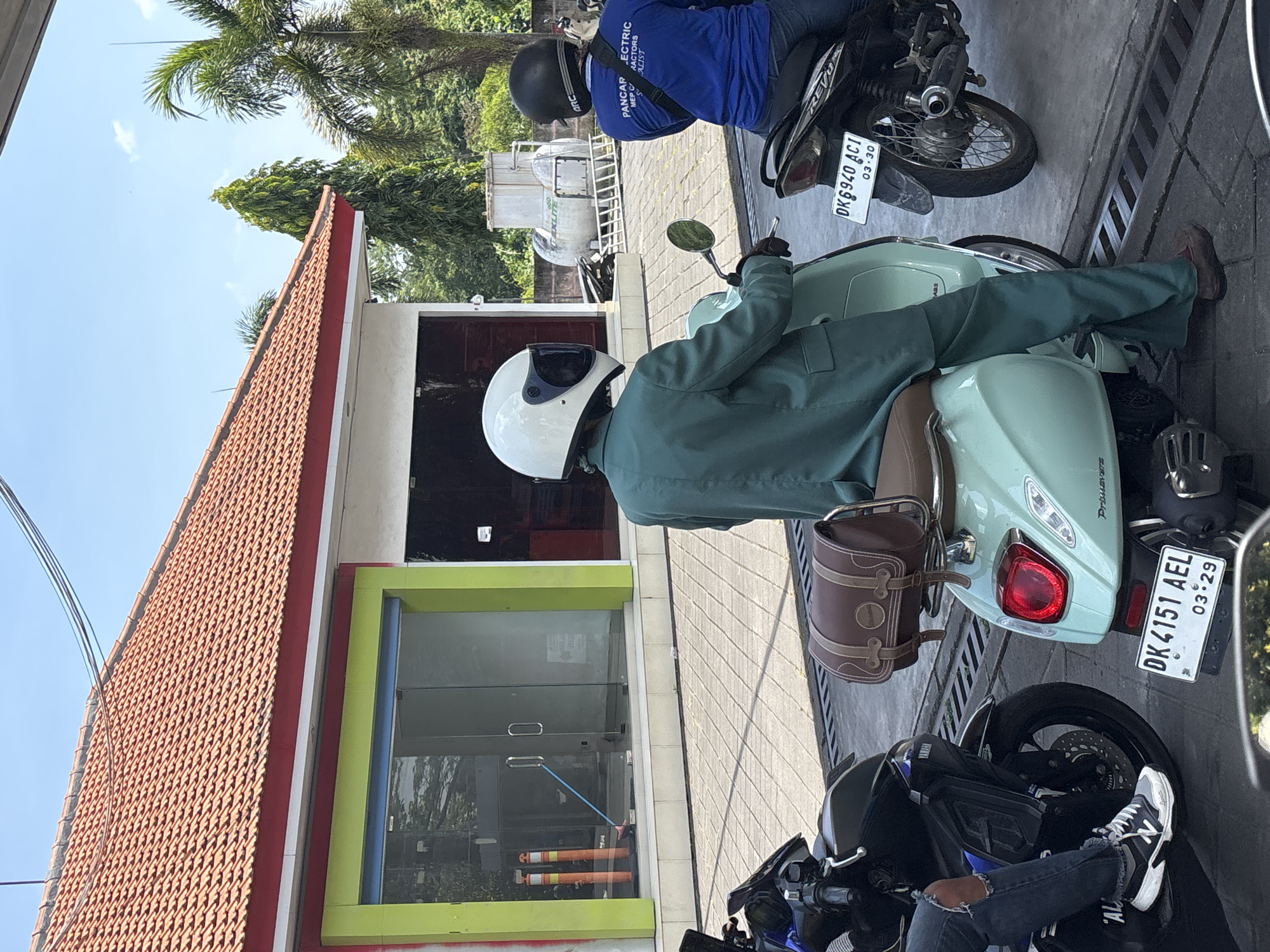 Morning motorcycle queue forms at Mengwi gas station