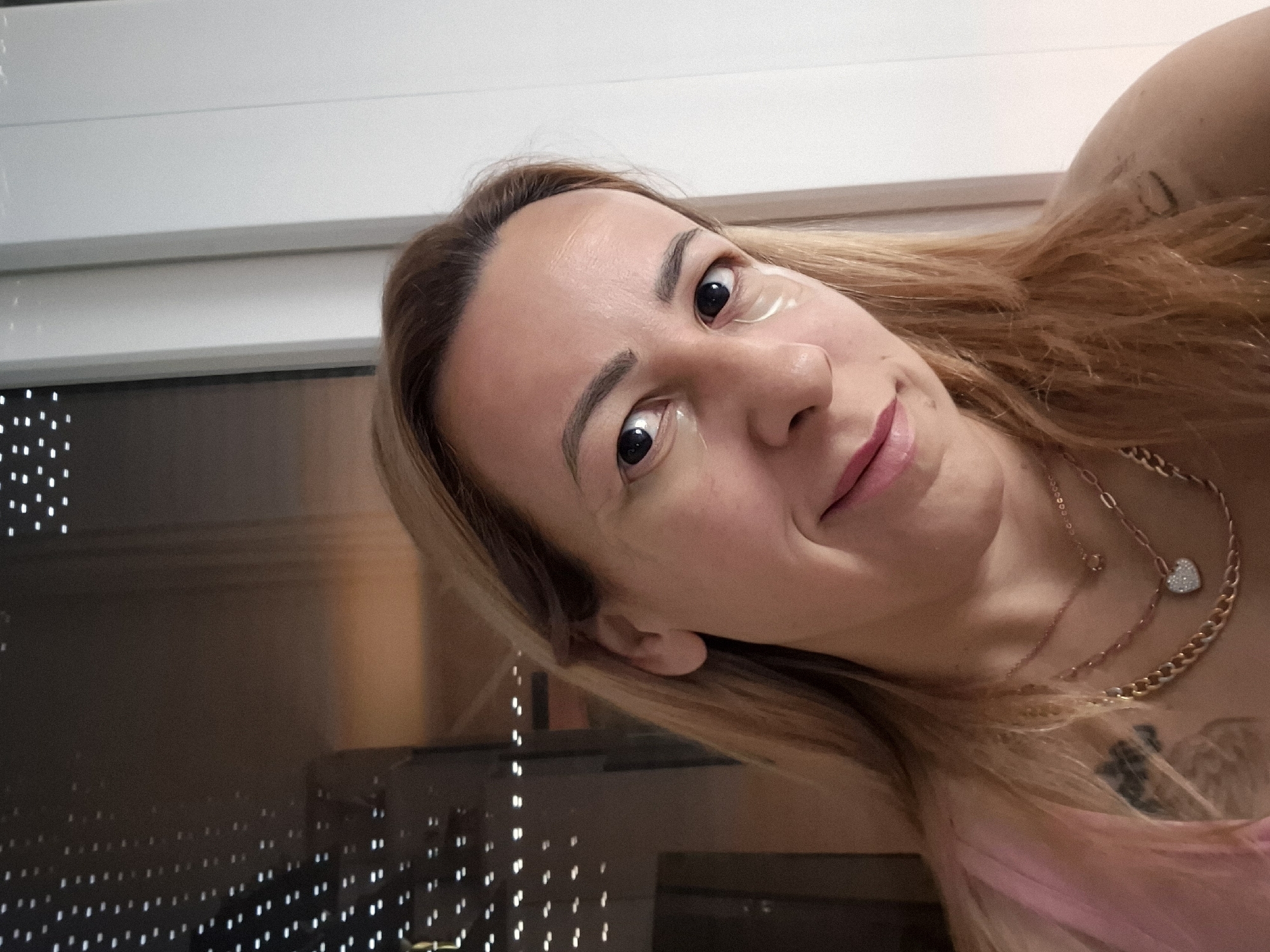 Woman documents early morning coffee routine during city sunrise