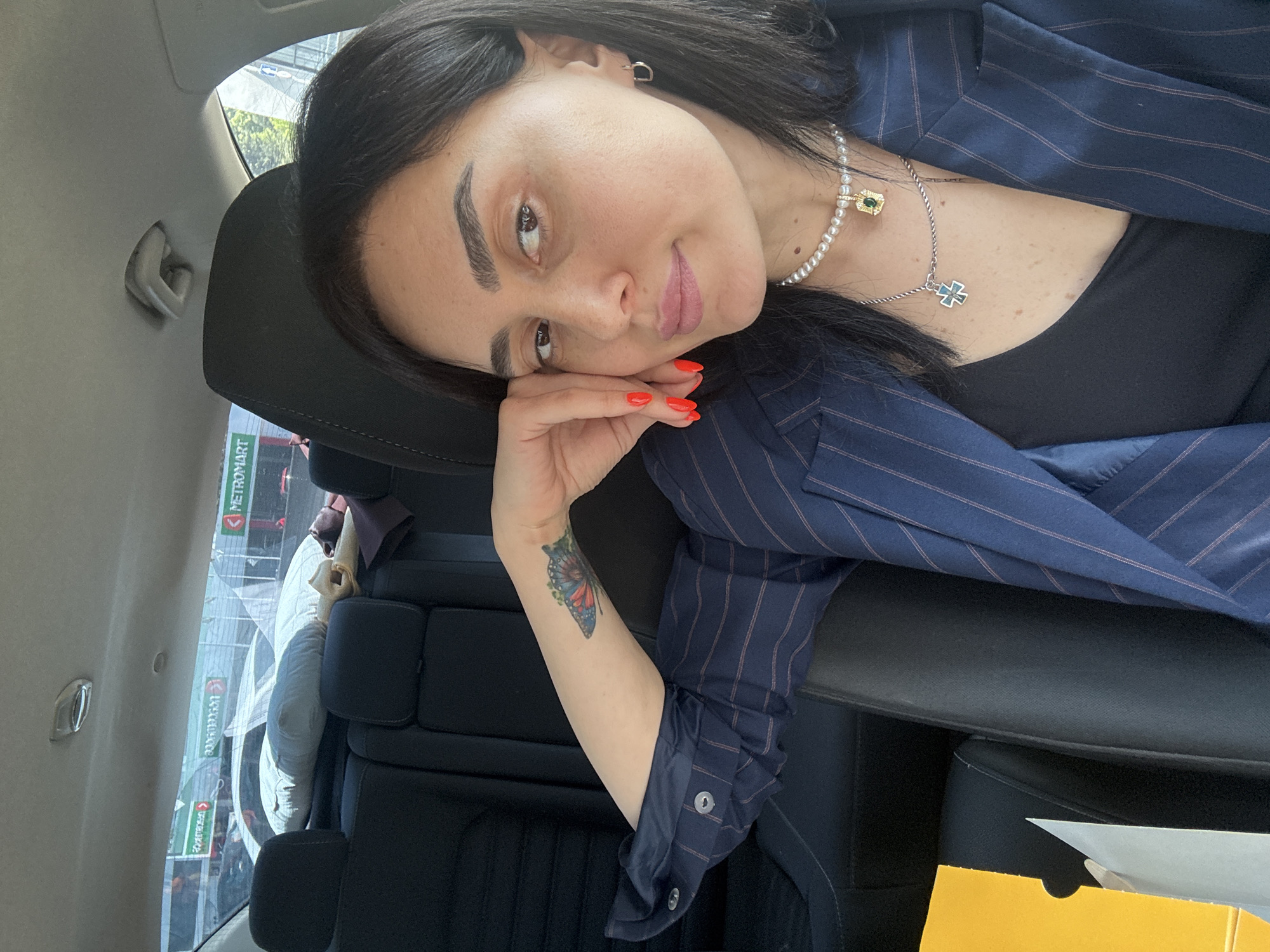 Woman takes car selfies in Tbilisi during morning hours