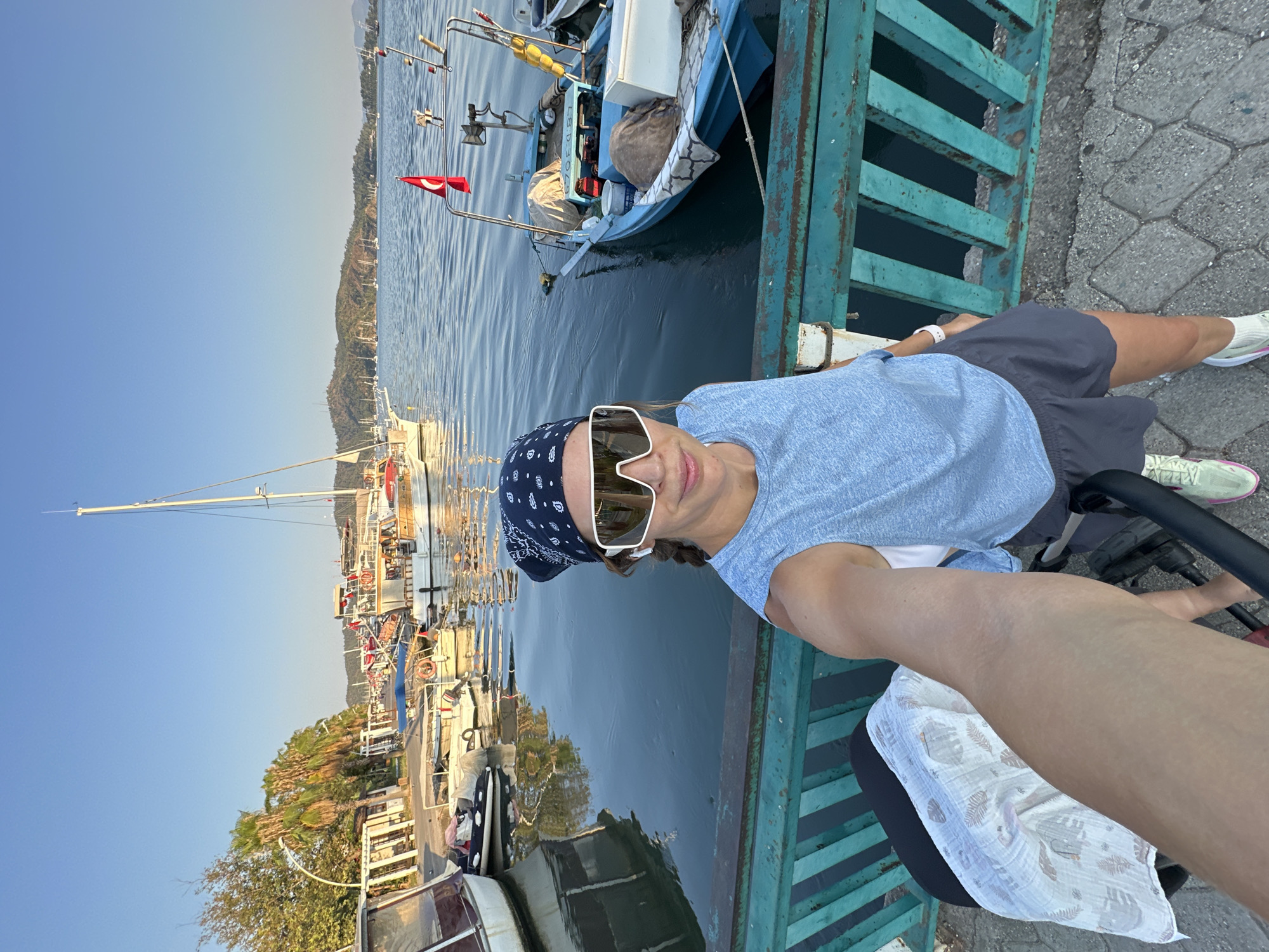 Fethiye harbor: fishing boats, calm water, pier selfie