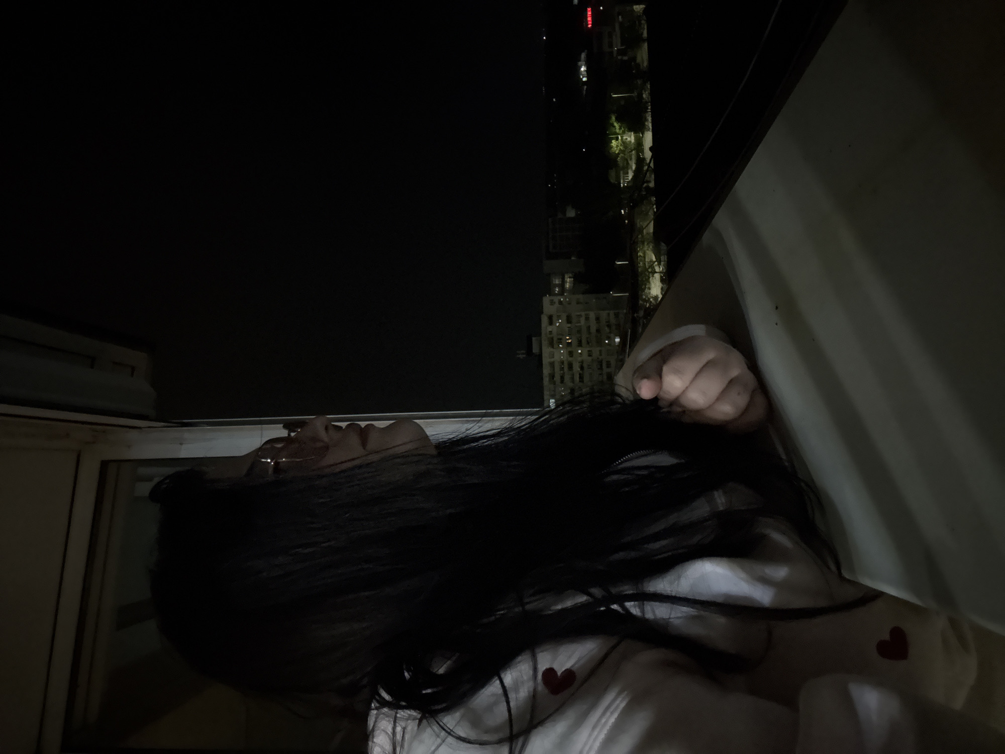 Woman spotted at window during nighttime in Sofia