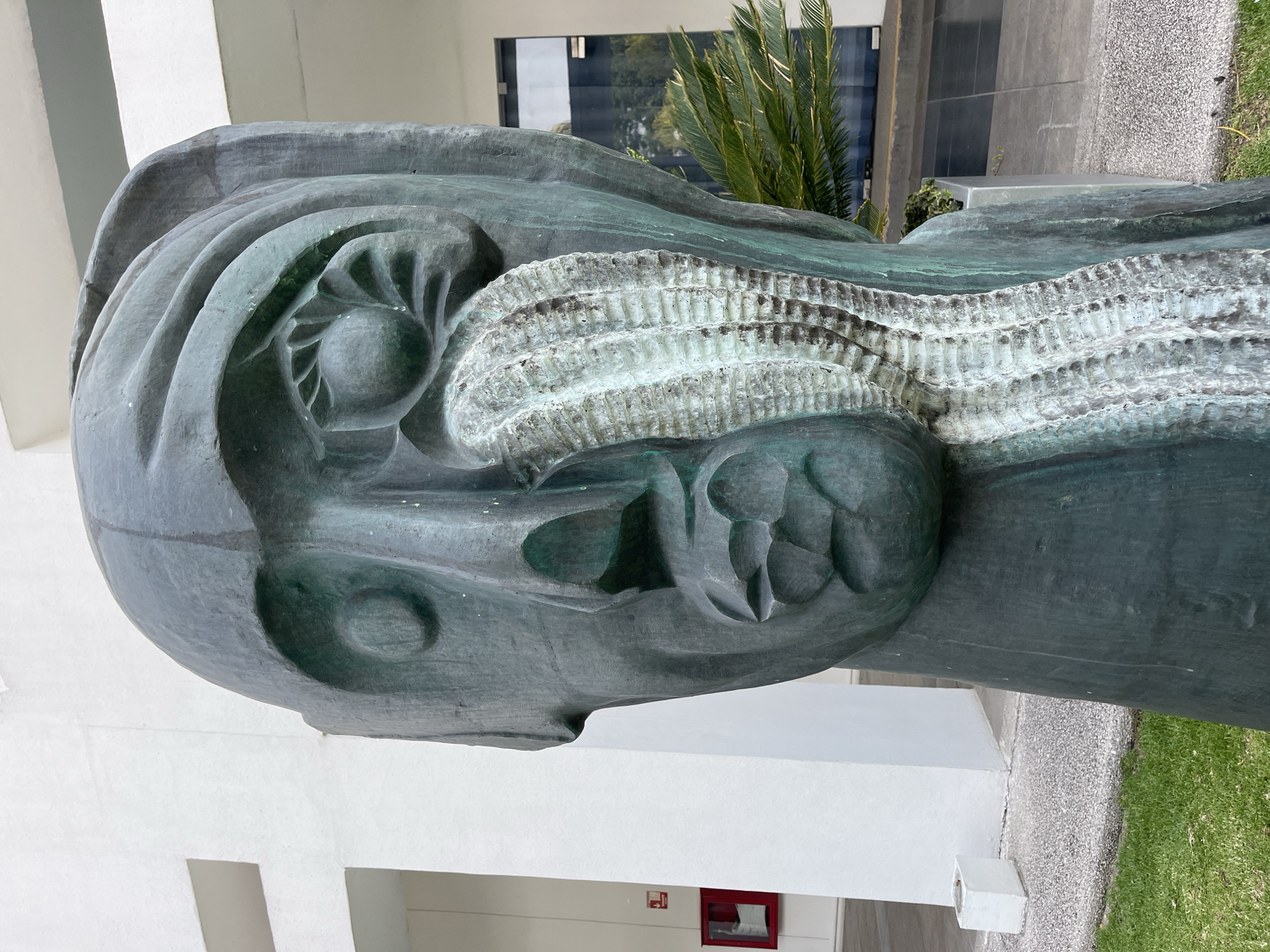 Metal Head Sculpture Documented in Urban Setting