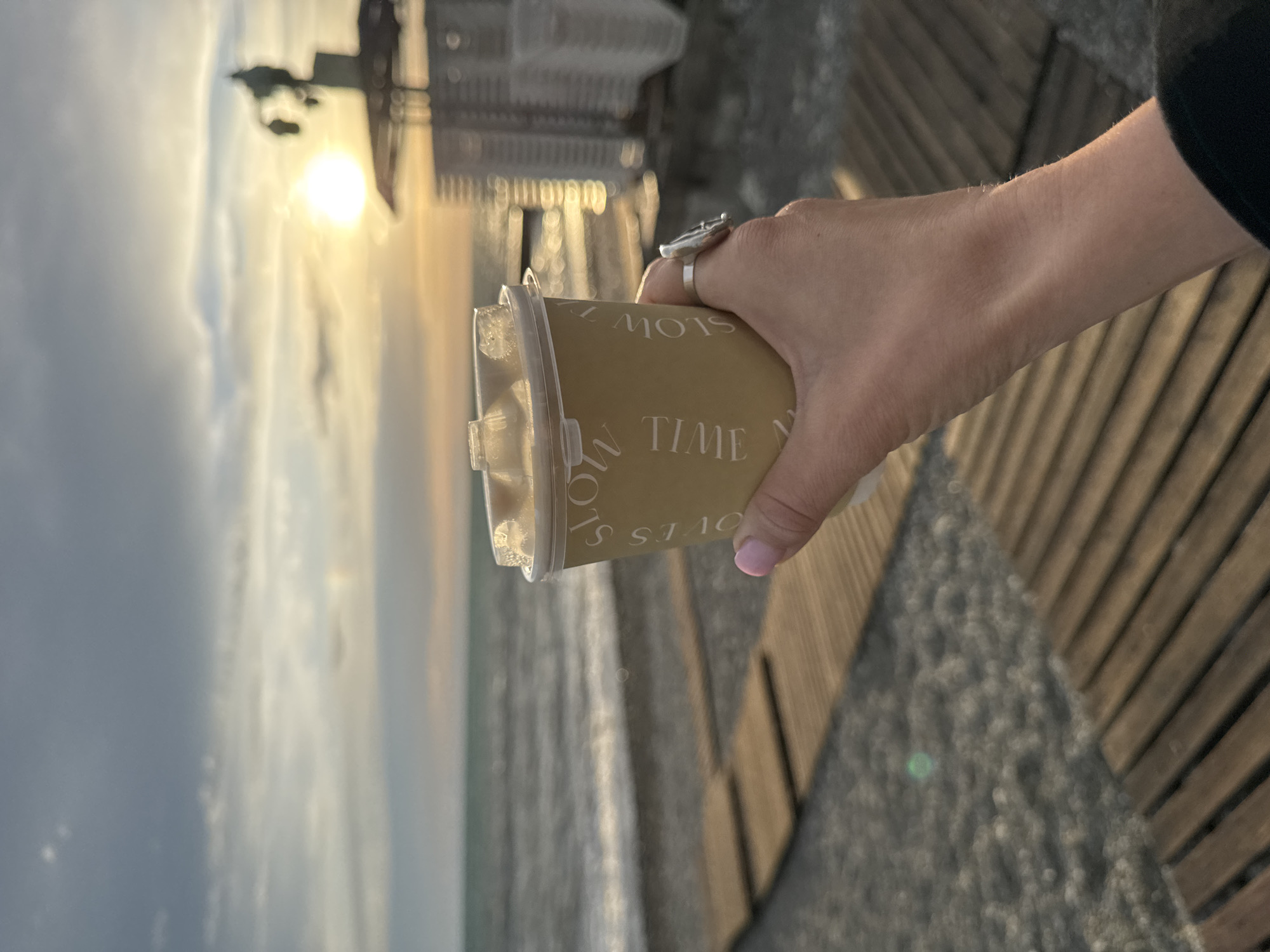 Visitor documents "SLOW TIME" coffee cup moments during Sochi sunset