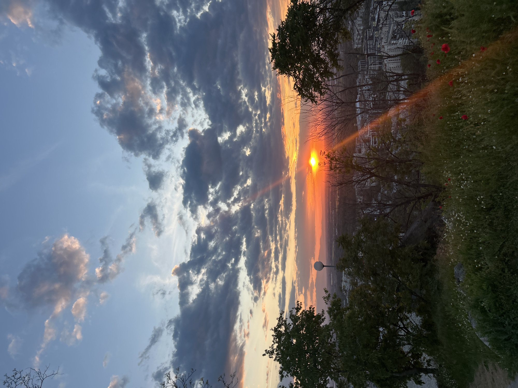 Dramatic sunset captured over Plovdiv from historic hilltop viewpoint
