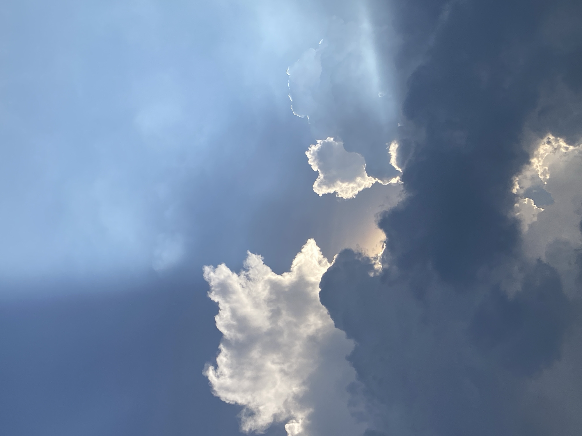 Sunlight breaks through scattered clouds over Ho Chi Minh City