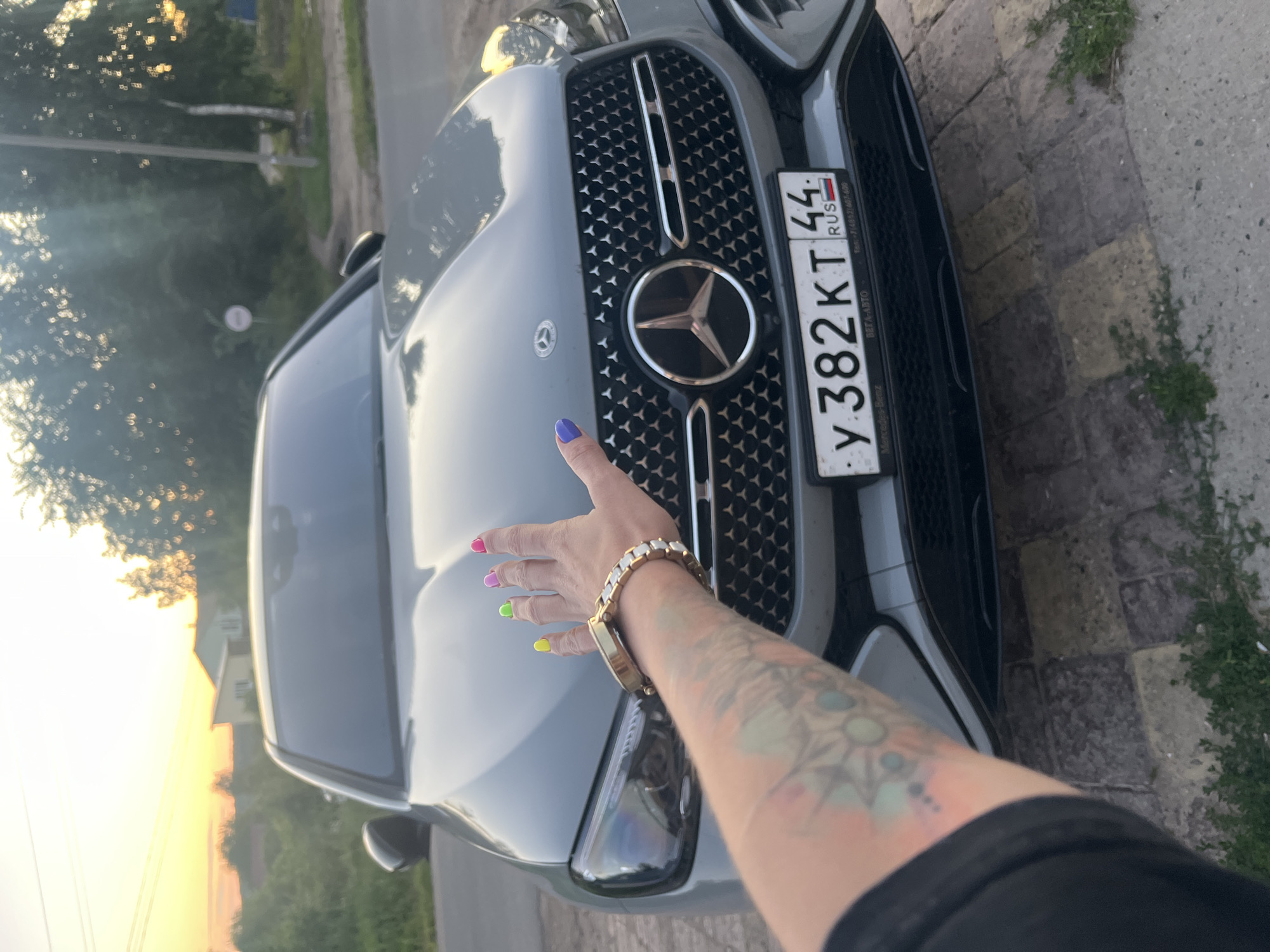 Gray Mercedes parked on brick driveway in Krasnoe-na-Volge