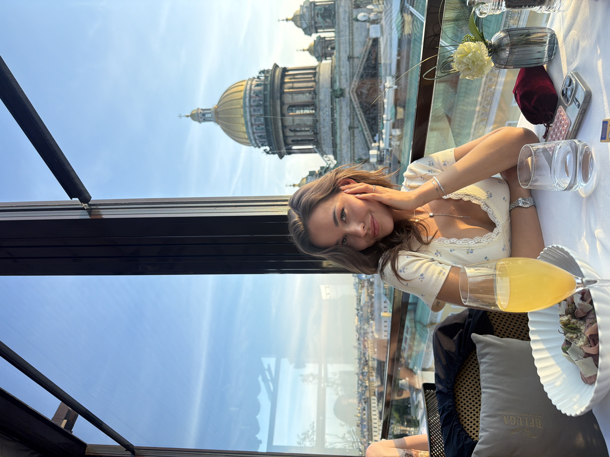 Woman enjoys sunset rooftop dining in Lednevo, Russia