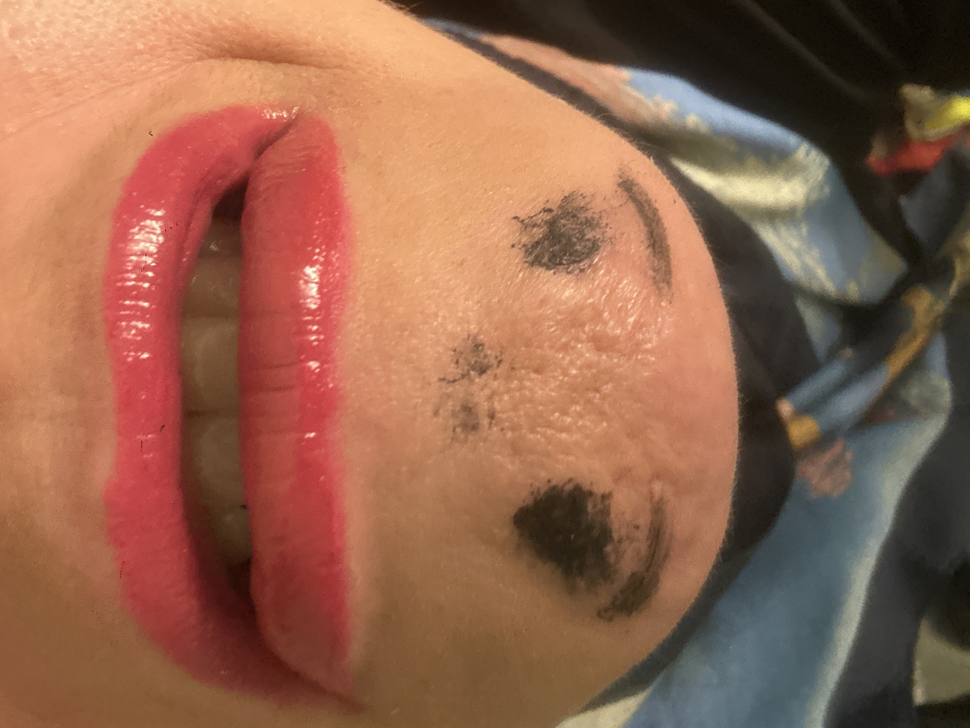 Person photographed with elaborate face makeup in Riga