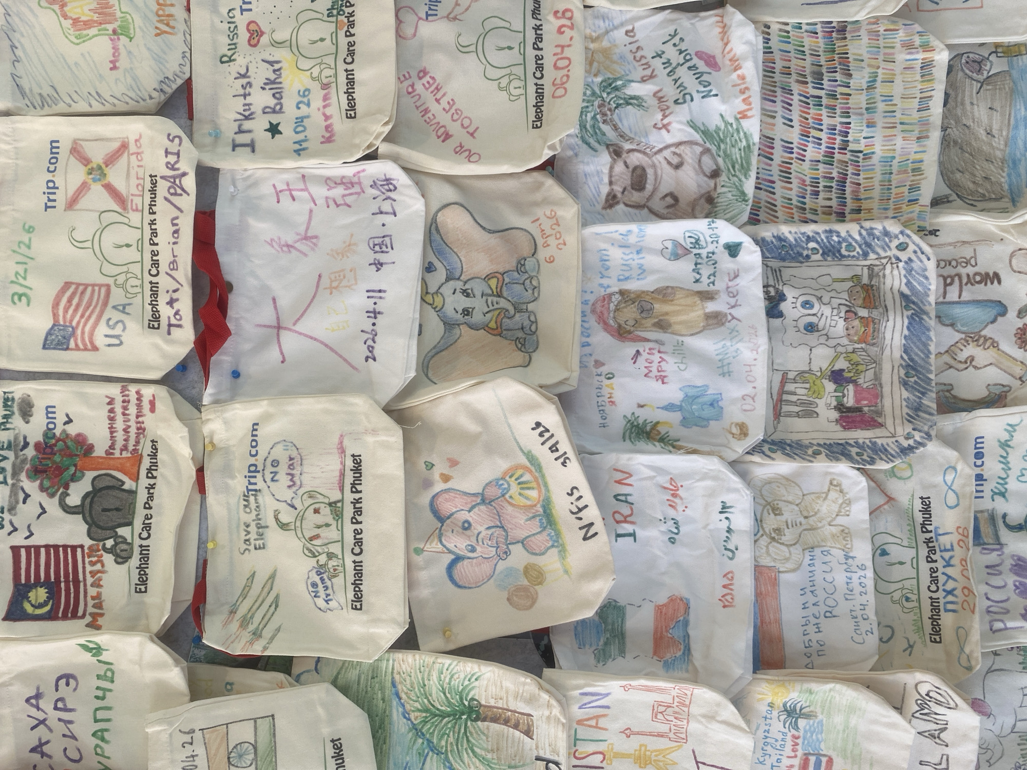 Tourist browses handmade fabric souvenirs at Thailand craft market
