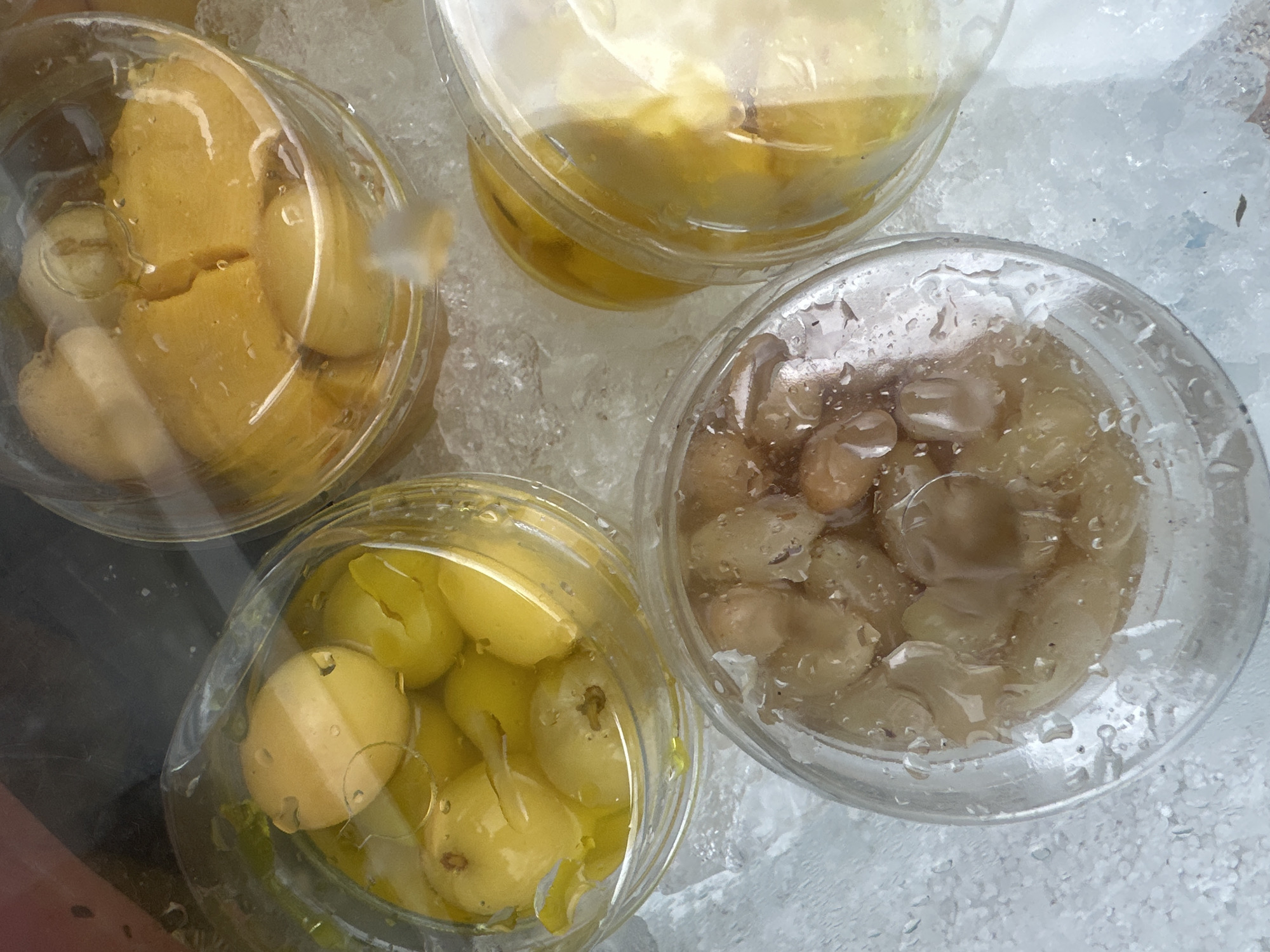 Fruit vendor serves preserved fruits from mobile stall in Koh Phangan