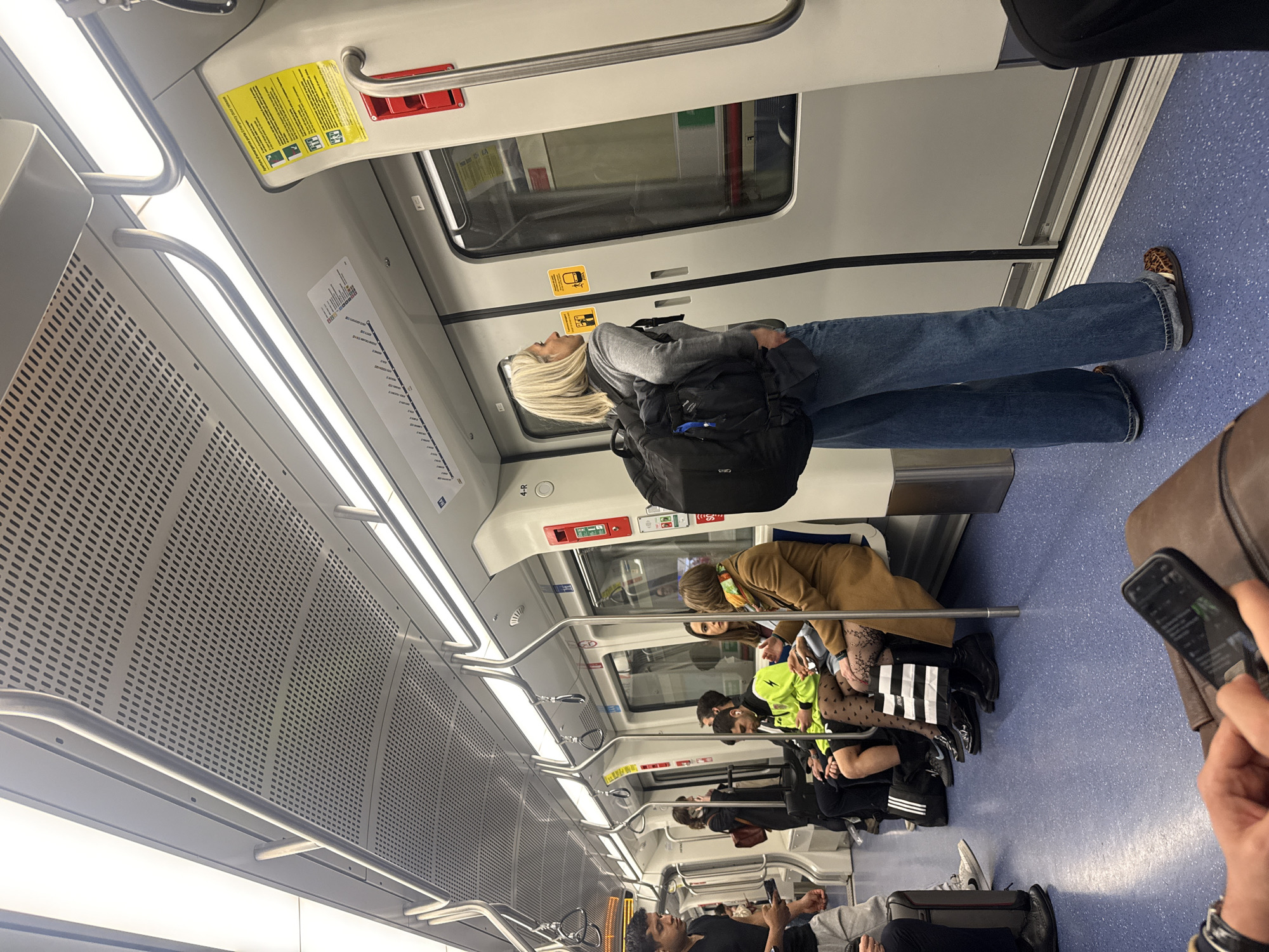 Overhead view of modern transit car interior captured