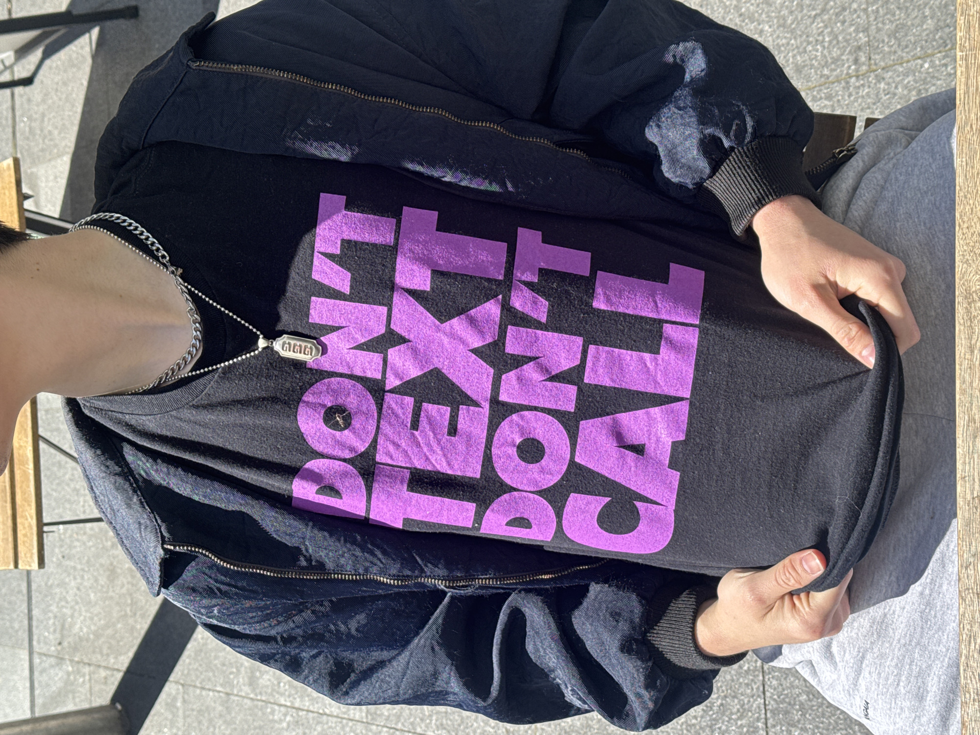 Person in "DON'T TEXT DON'T CALL" shirt spotted in London