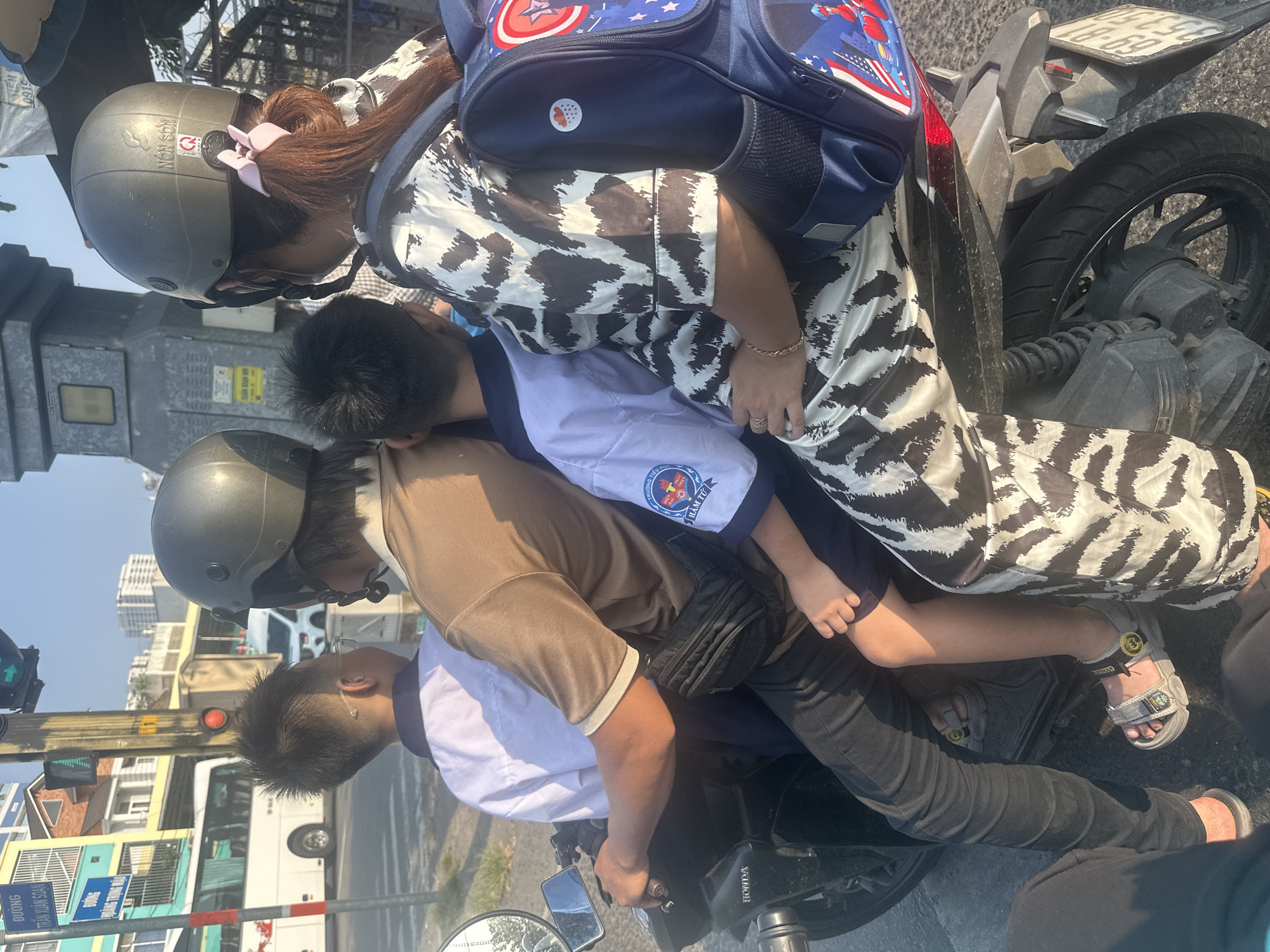Adult with two children spotted riding motorcycle in Ho Chi Minh City