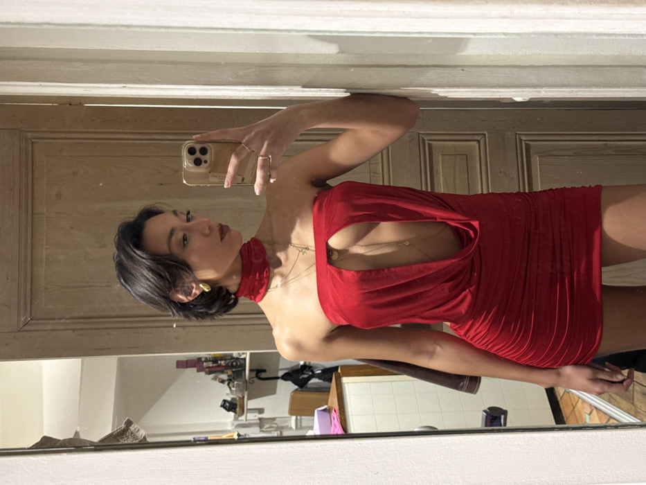 Woman Takes Mirror Selfies in Paris Indoor Location