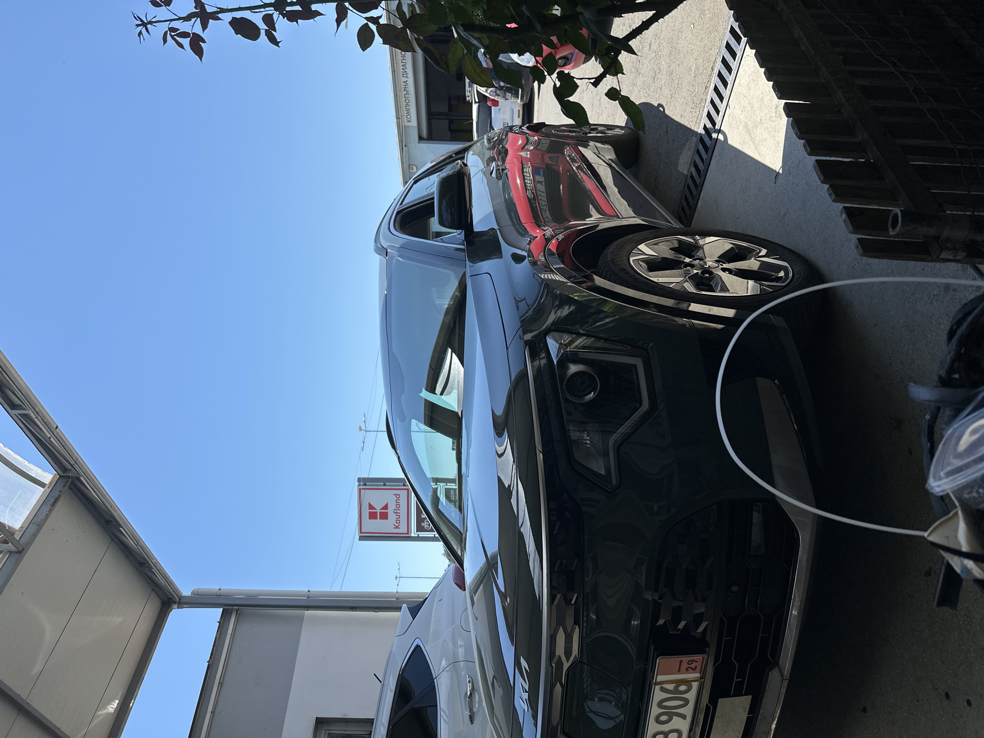 Automotive scenes documented near commercial area over minutes