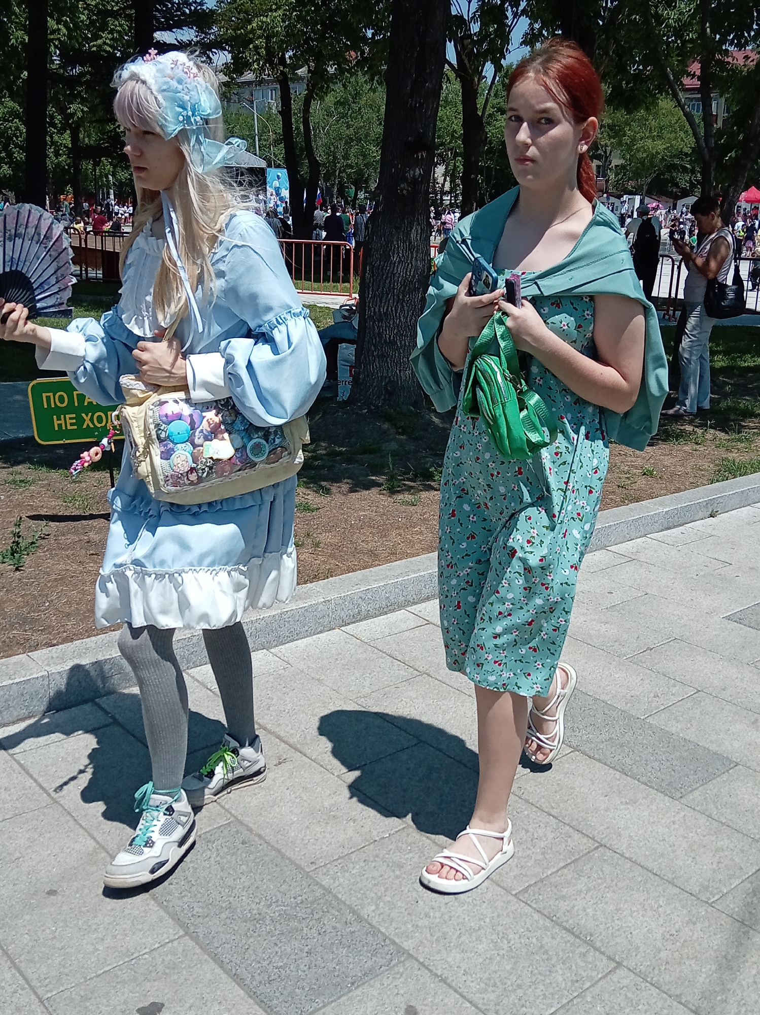 Cultural parade with traditional costumes and costumed horses in Artyom