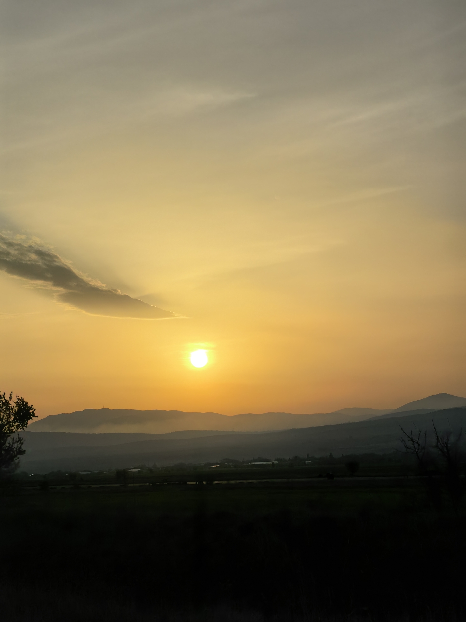 Sunset observed over mountains from multiple locations April 14
